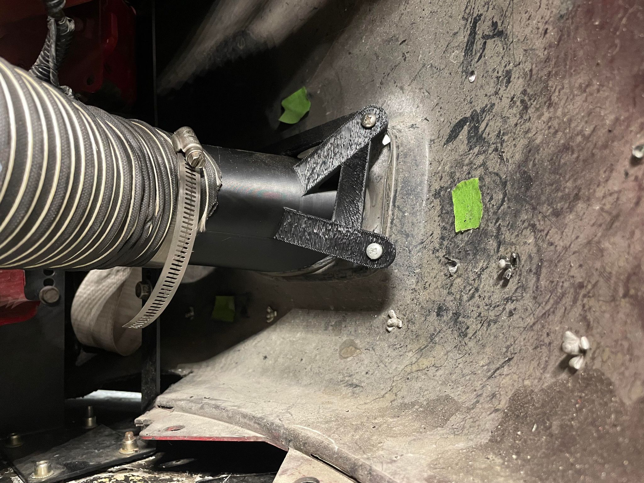 Close-up of the bumper duct opening on a red Civic Coupe FG2 front bumper with tow strap