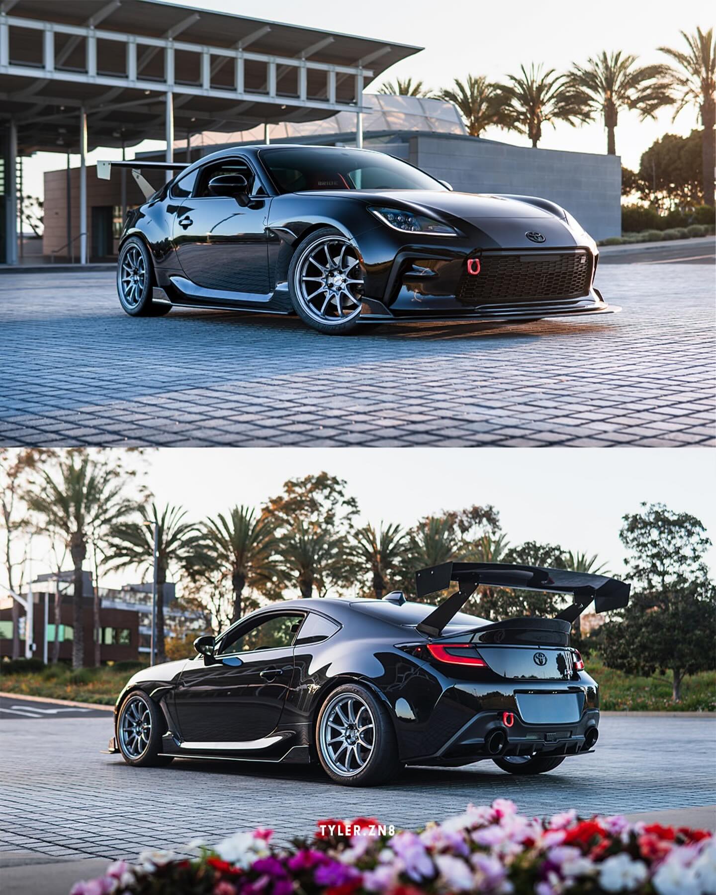 Front three-quarter view of a black BRZ ZN8 with GT wing parked outdoors