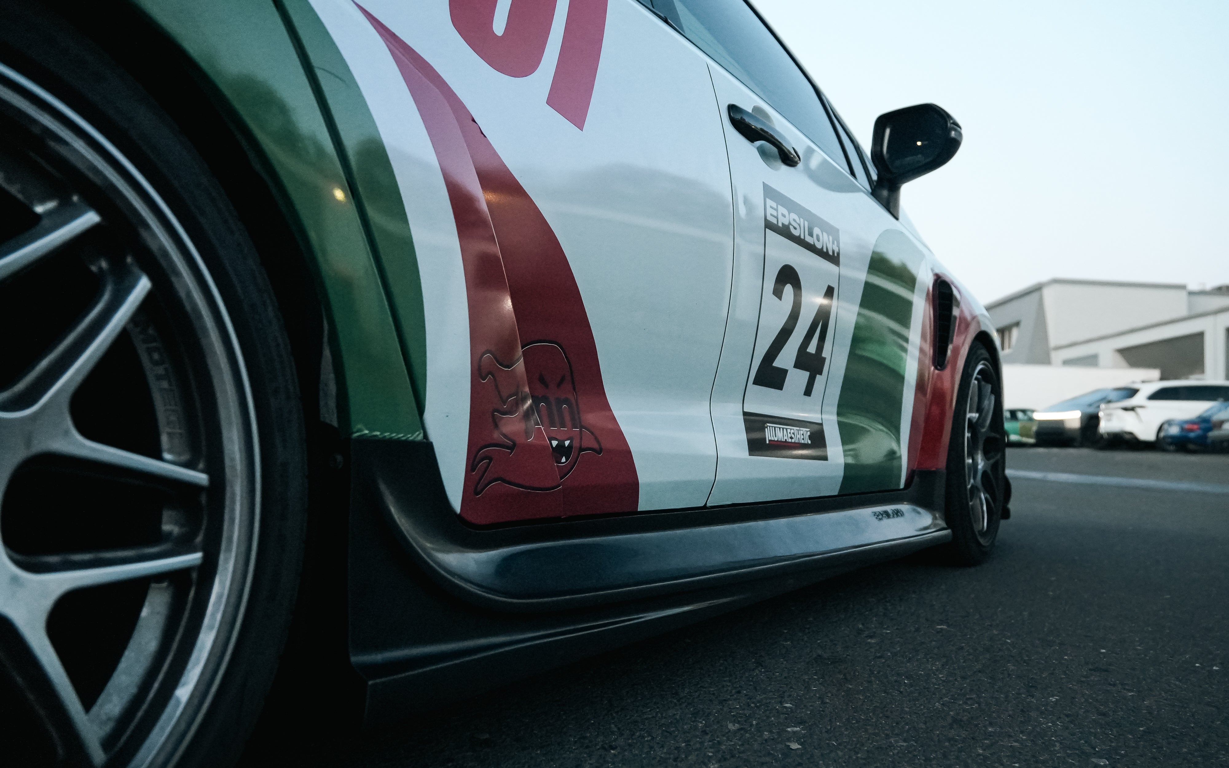 Close-up of the side skirt V2 on a white Castrol-livery GR Corolla rally car