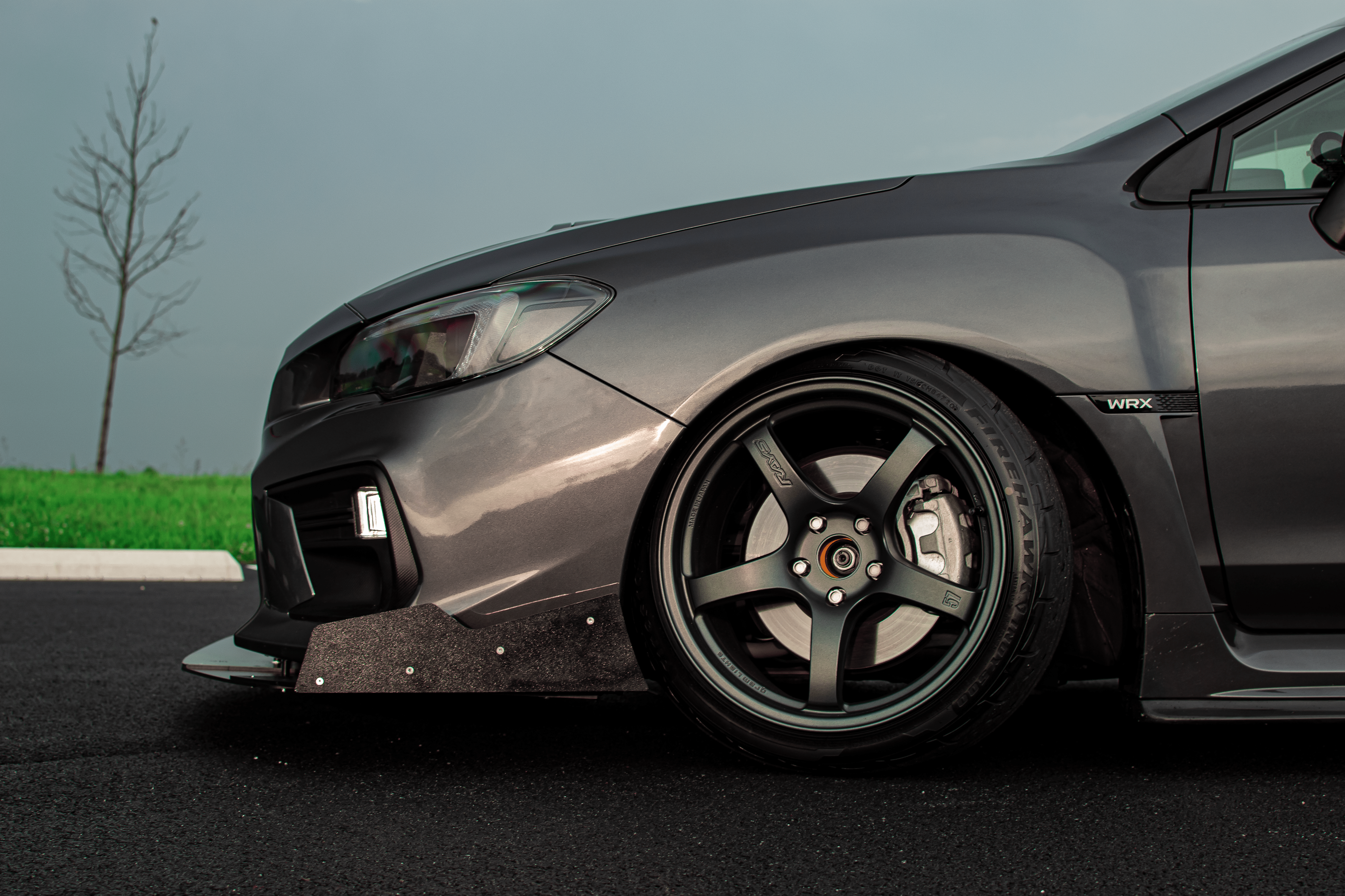 Side profile of a gray Subaru WRX VA with front splitter, low stance