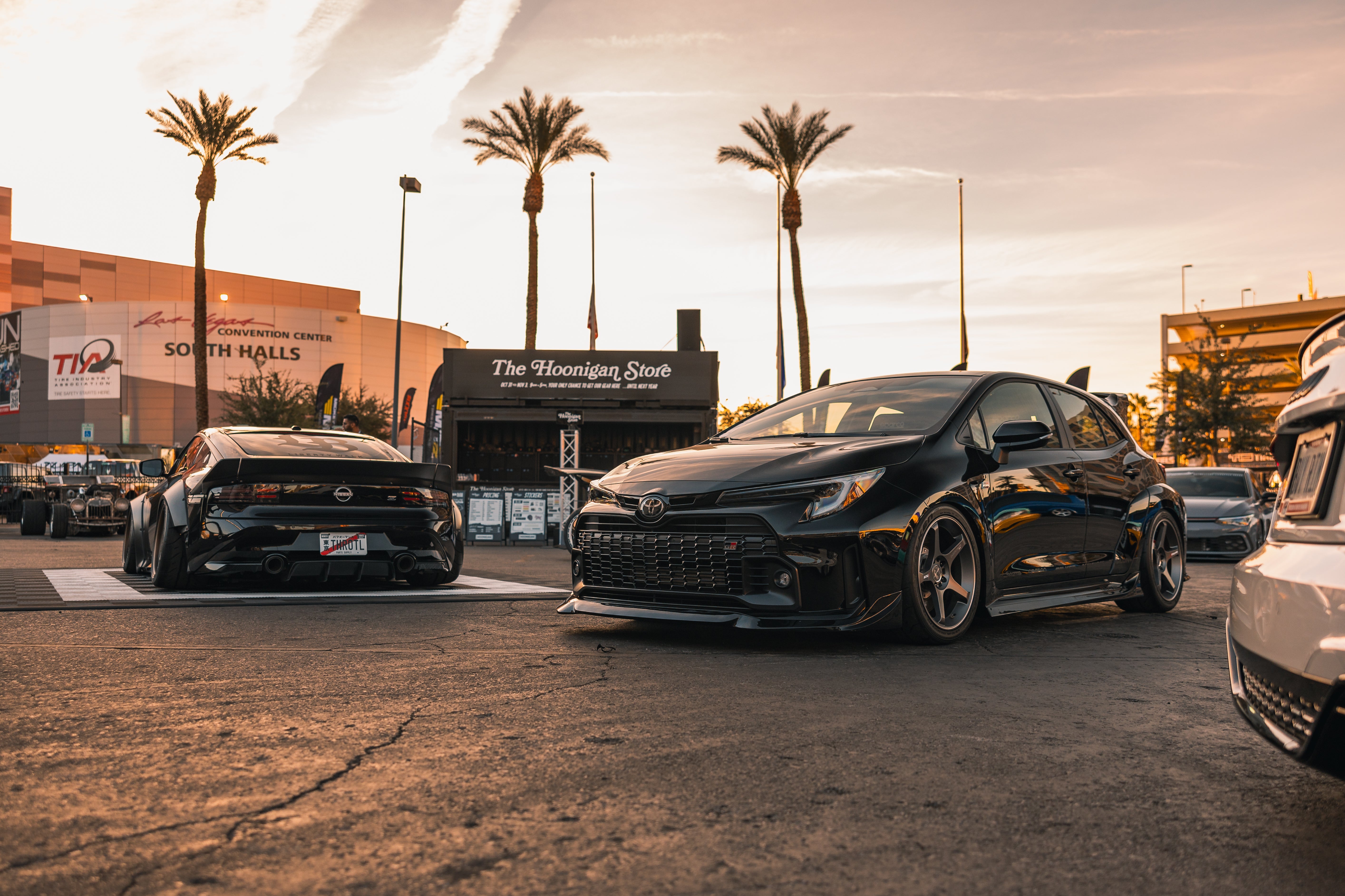 Black GR Corollas with side skirts parked together at sunset