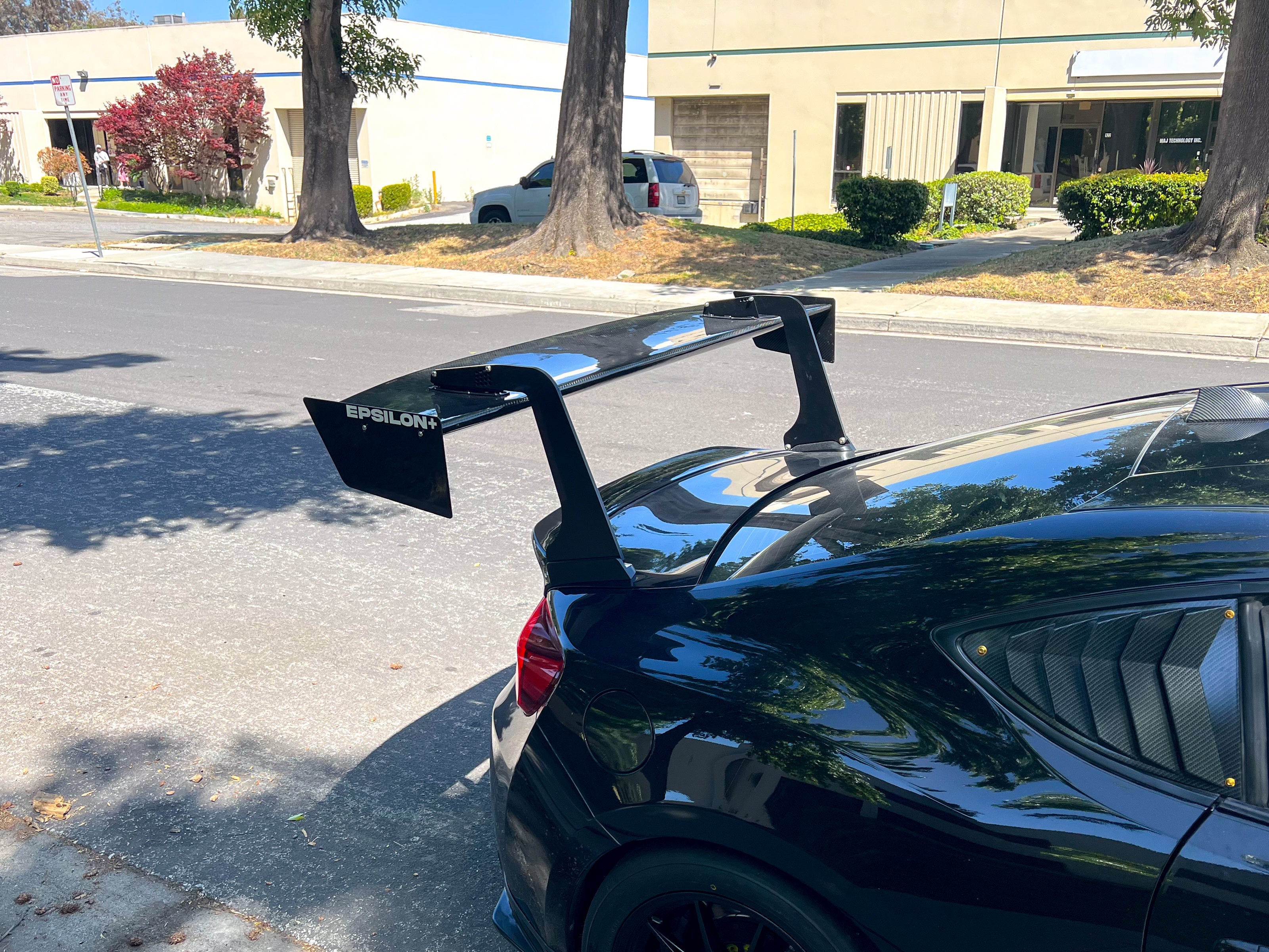 Angled close-up of the GT wing mount on a black FRS/BRZ roofline