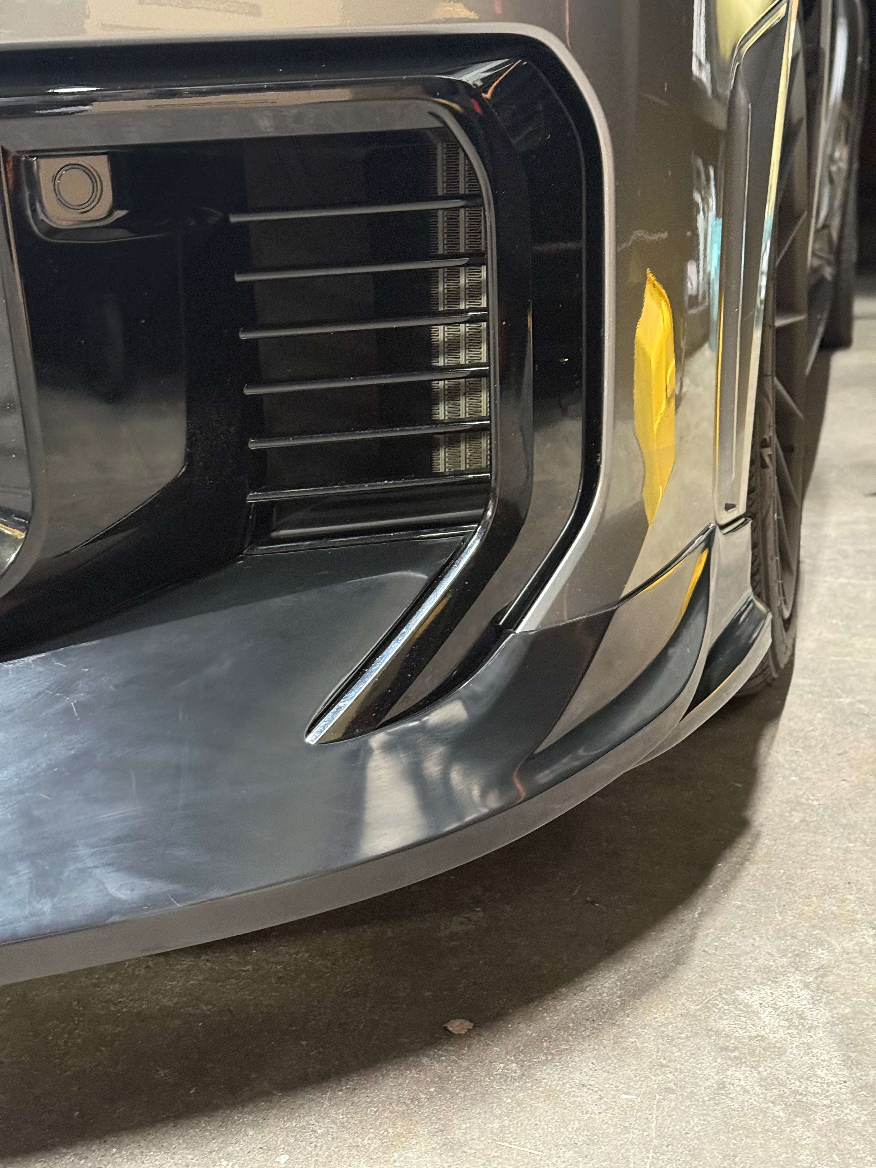 Close-up front view of the front lip on a gray GR Corolla Kouki