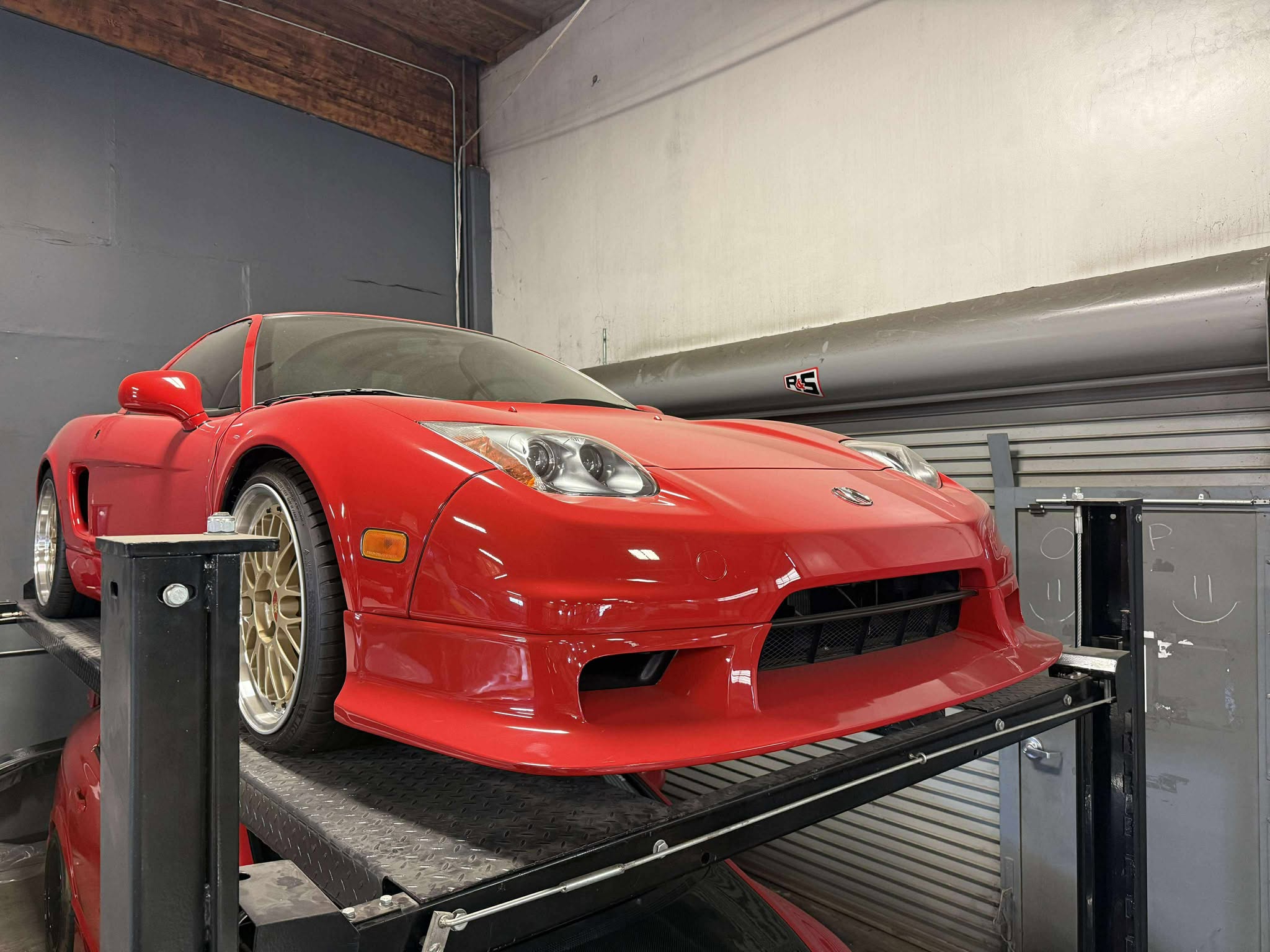 Front view of a red Acura NSX NA2 with the Epsilon+ R-GT front lip