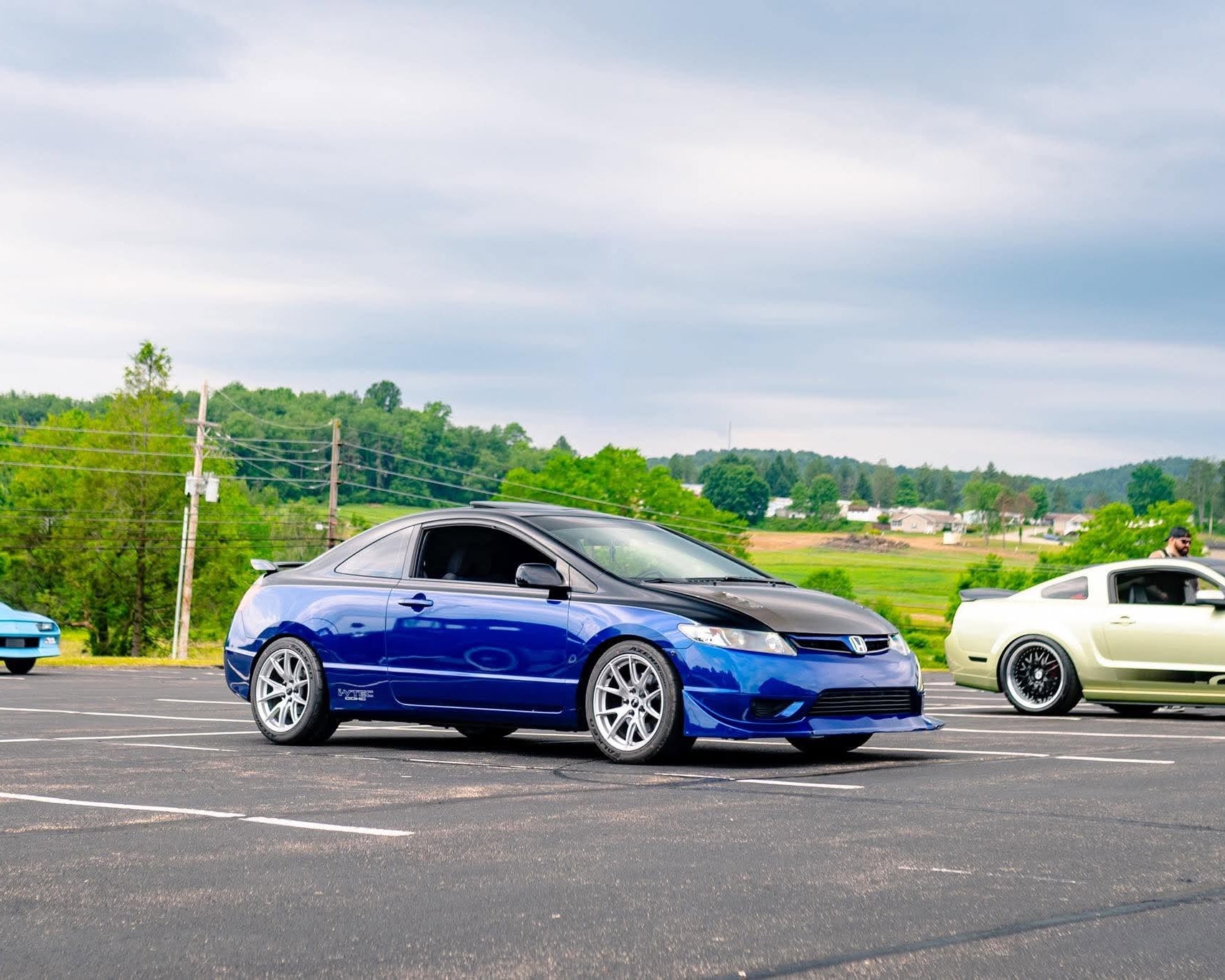Side profile of a blue Honda Civic Coupe FG2 with the Epsilon+ front lip