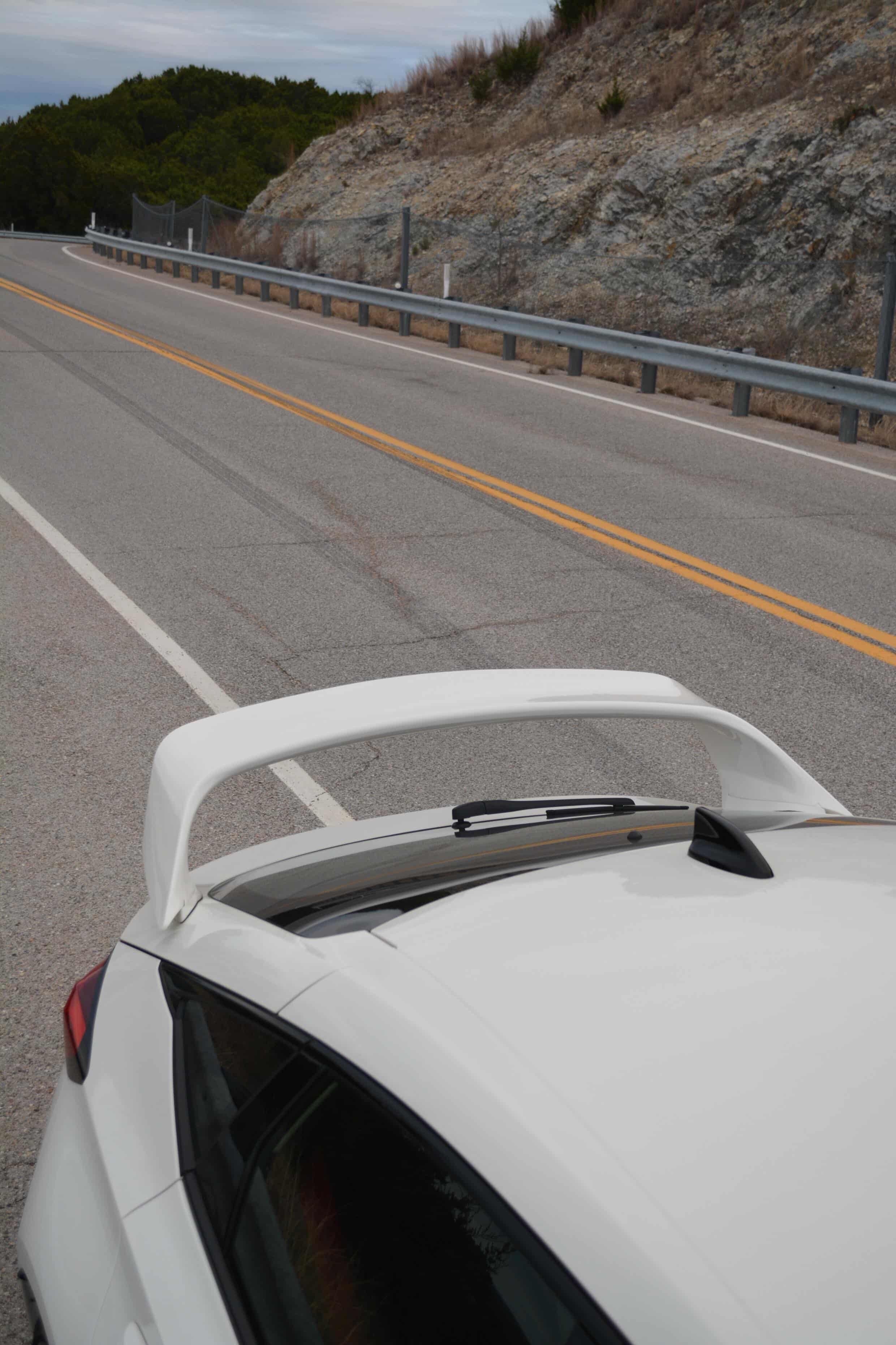 Close view of the Epsilon+ Sport Wing profile on a white Honda Civic FL5