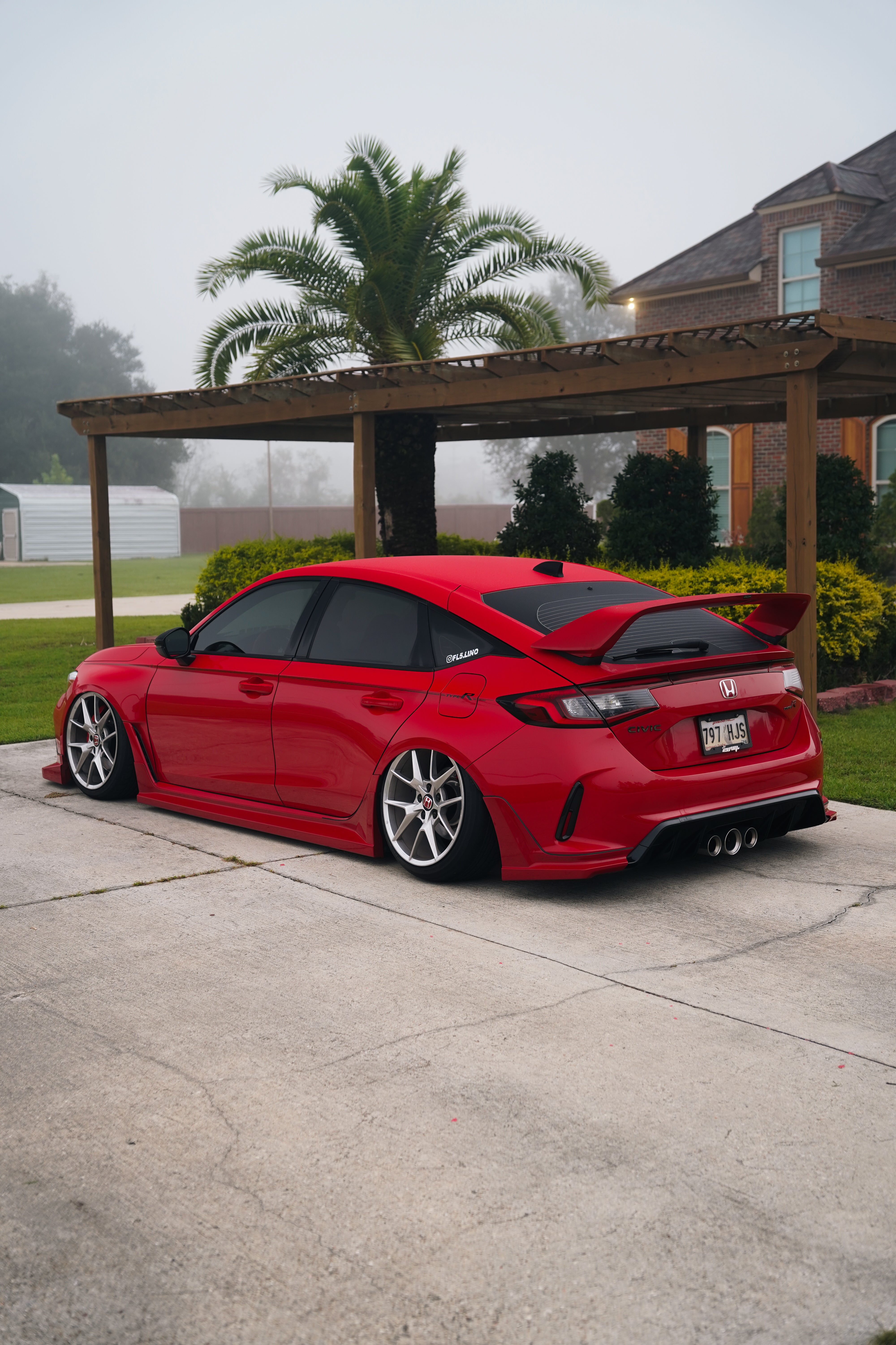 Red Honda Civic FL5 with the Epsilon+ Sport Wing in a driveway