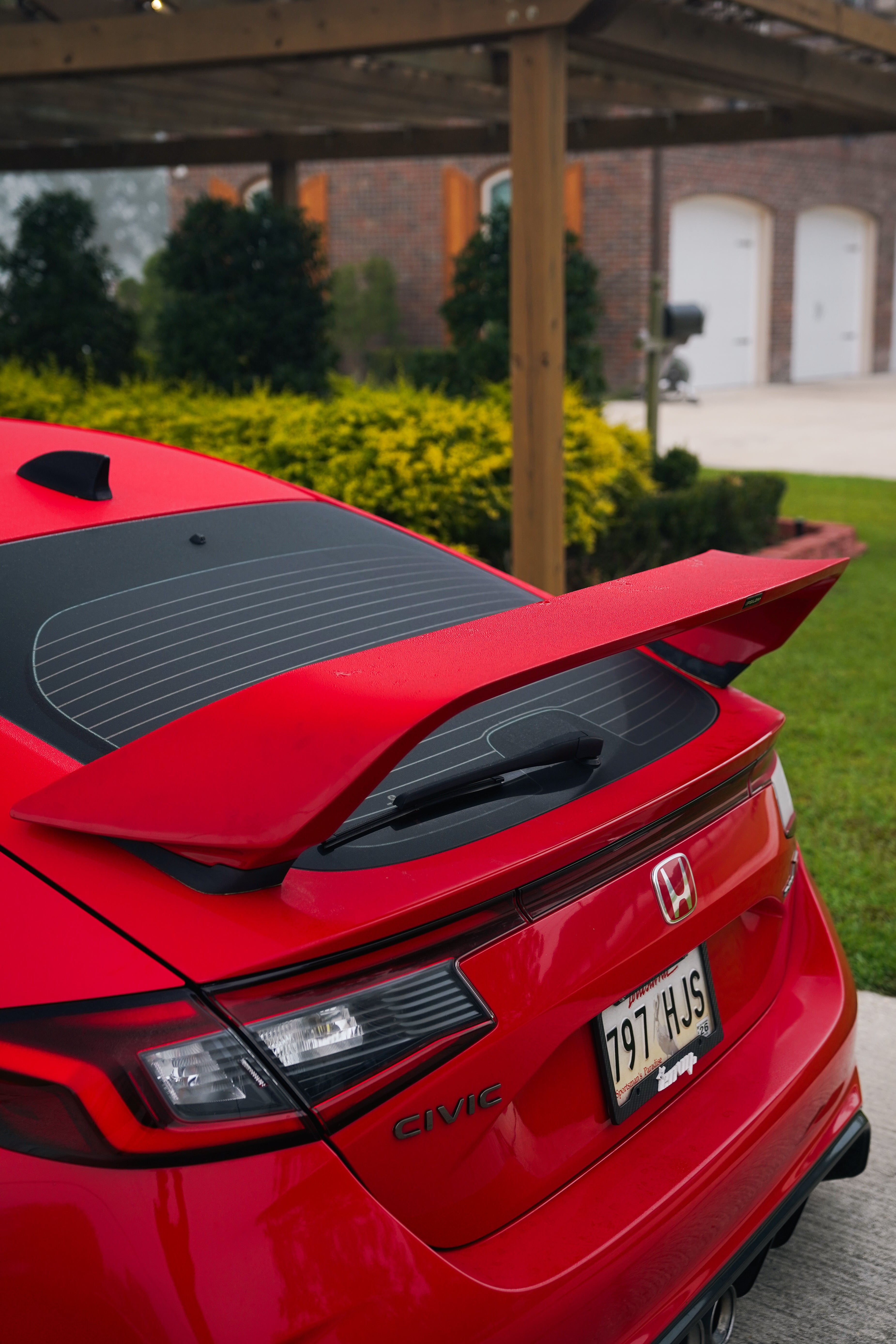 Close rear view of the Sport Wing on a red Honda Civic Type R FL5