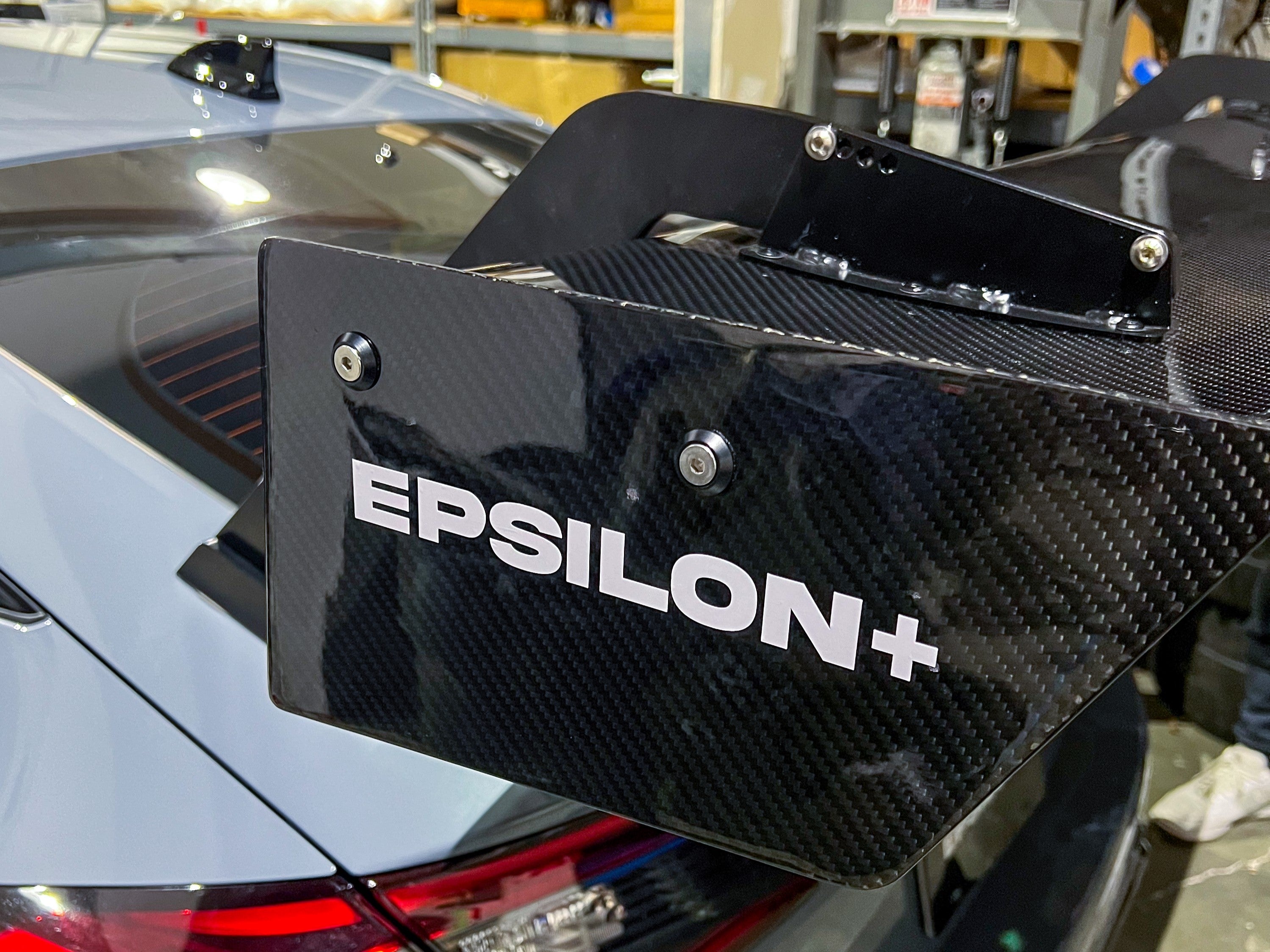 Close-up of the Epsilon+ branded carbon endplate on the Civic Type R FL5 GT wing