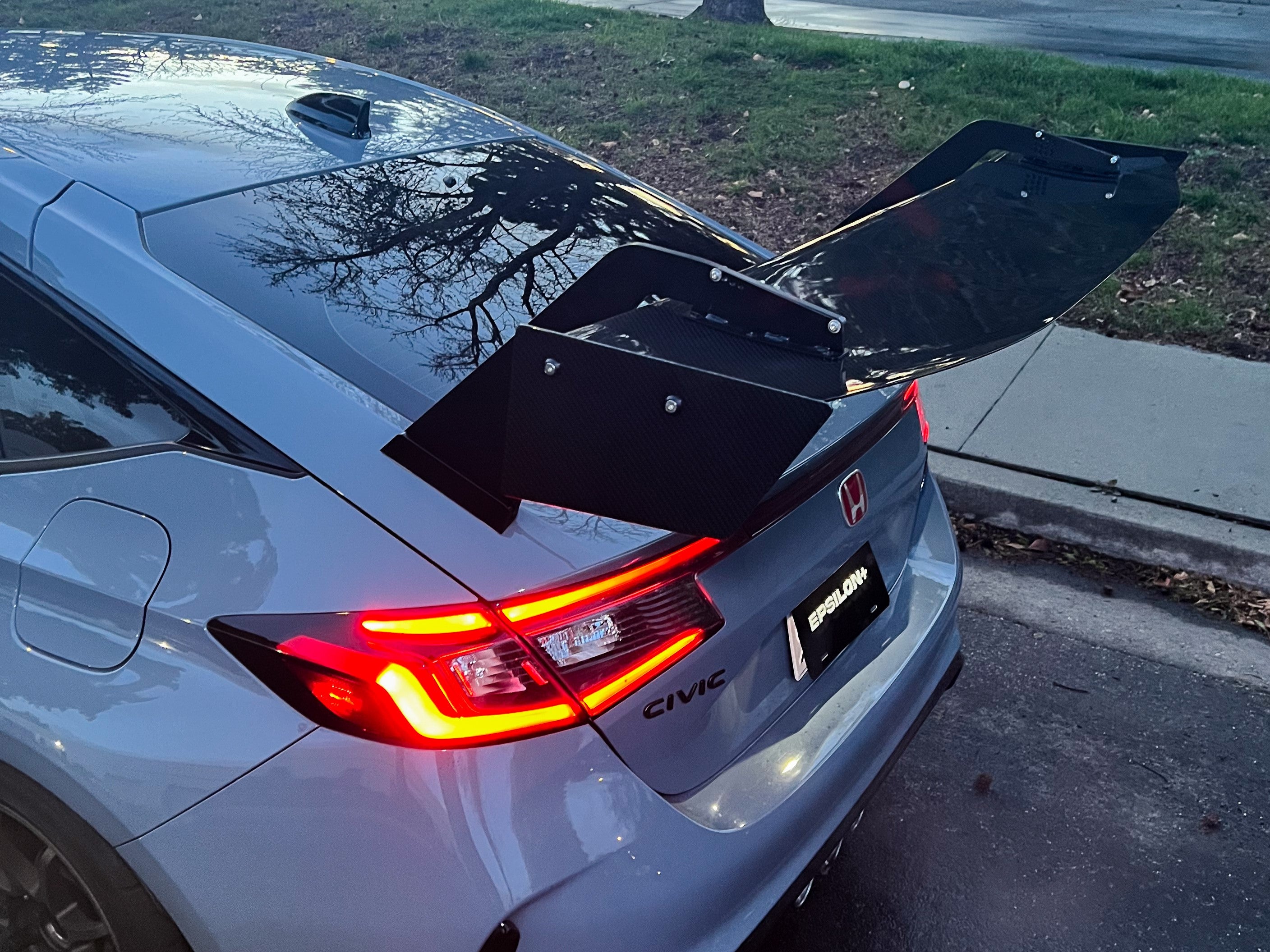 Close rear three-quarter view of a gray Civic Type R FL5 with GT wing