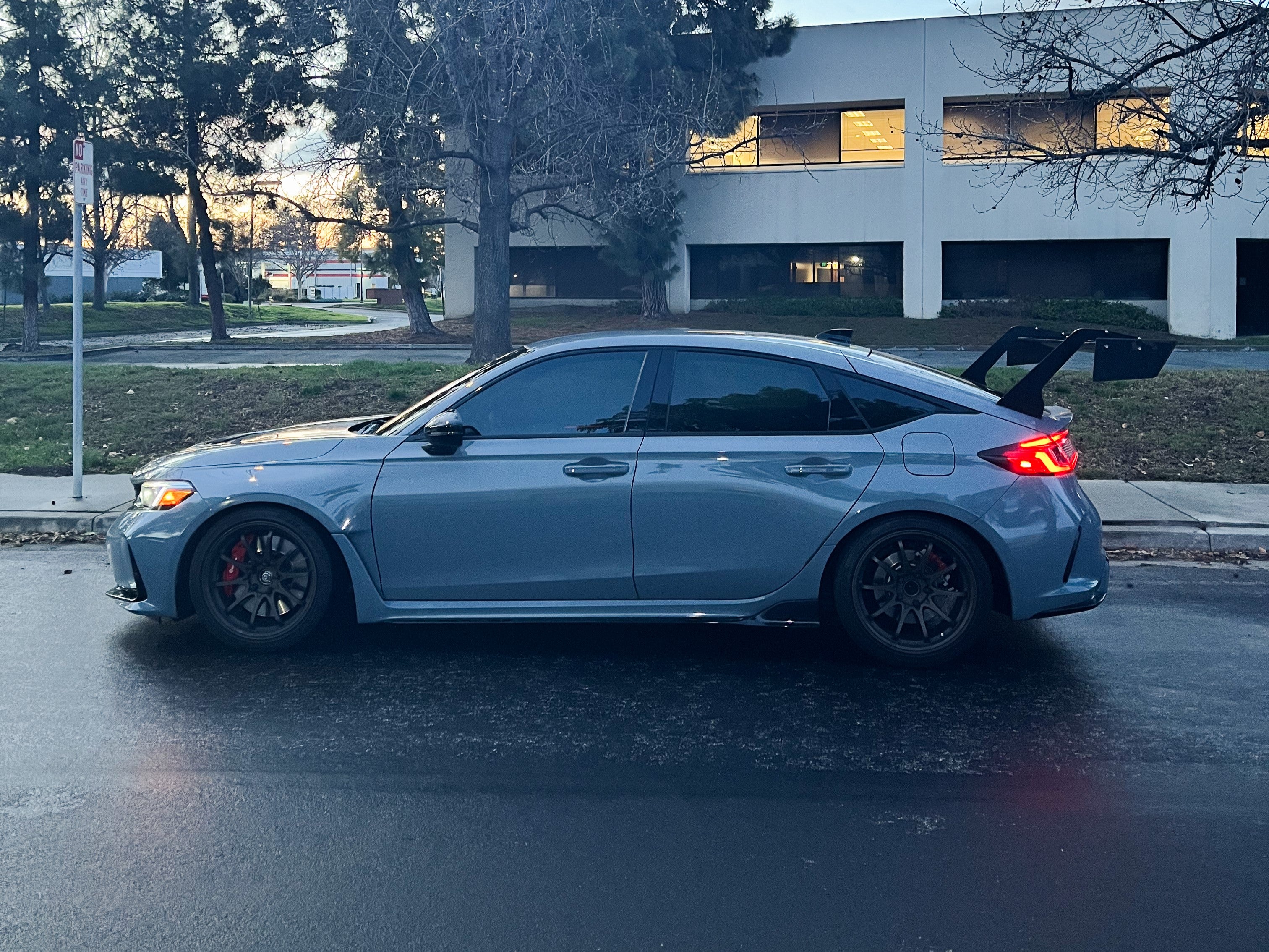 Side profile of a gray Honda Civic Type R FL5 showing the GT wing height