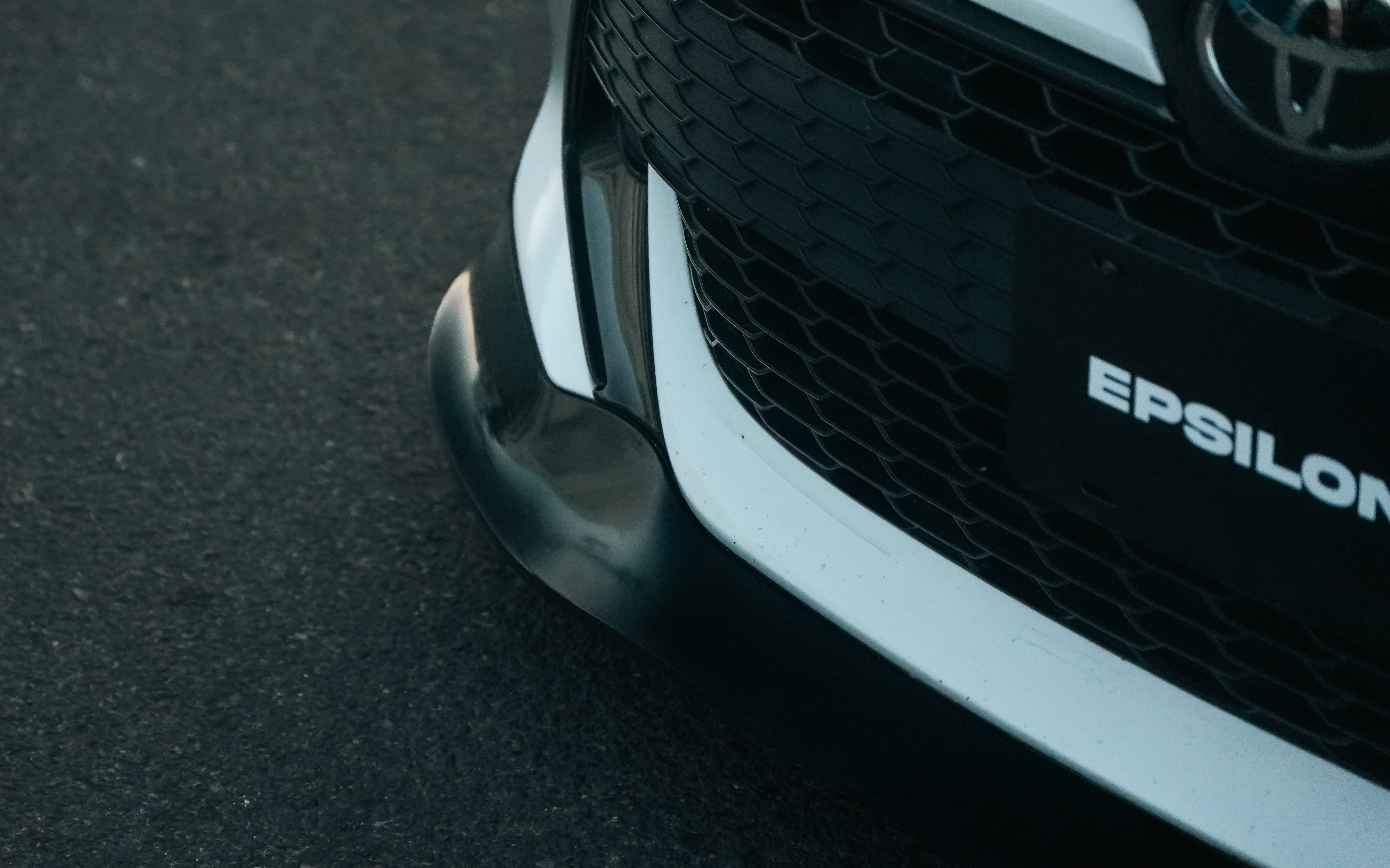 Detail of the Epsilon+ logo on the front lip of a Toyota Corolla Hatchback