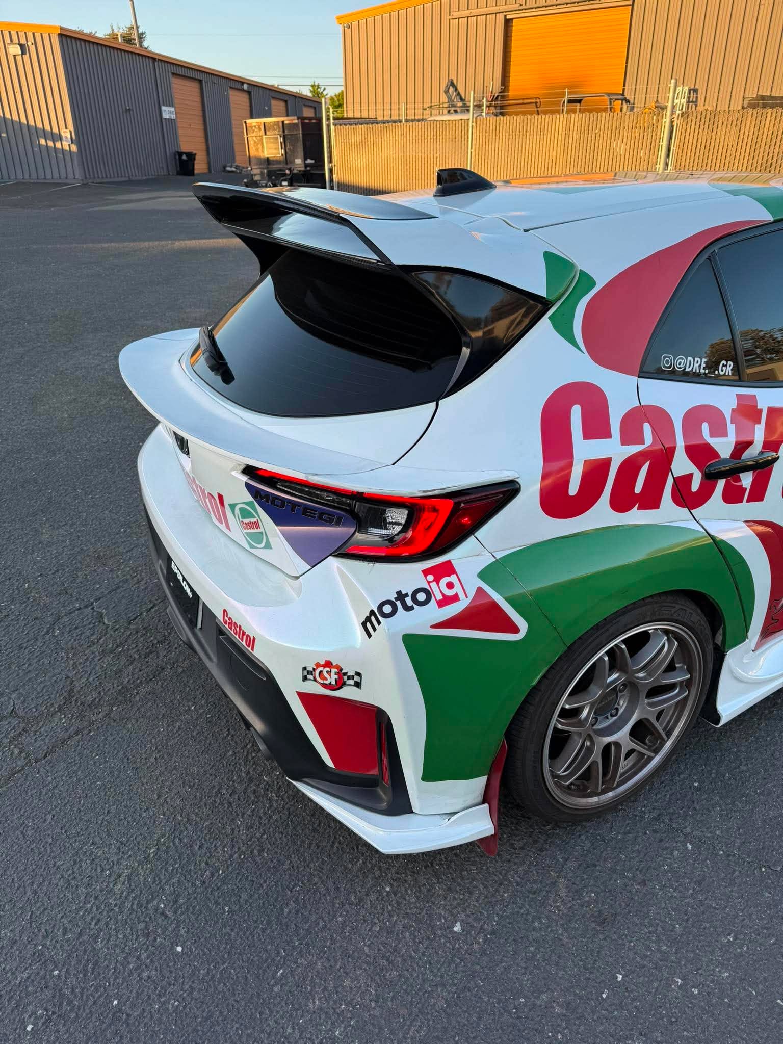 Rear three-quarter view of a Castrol Corolla Hatchback with the mid wing fitted