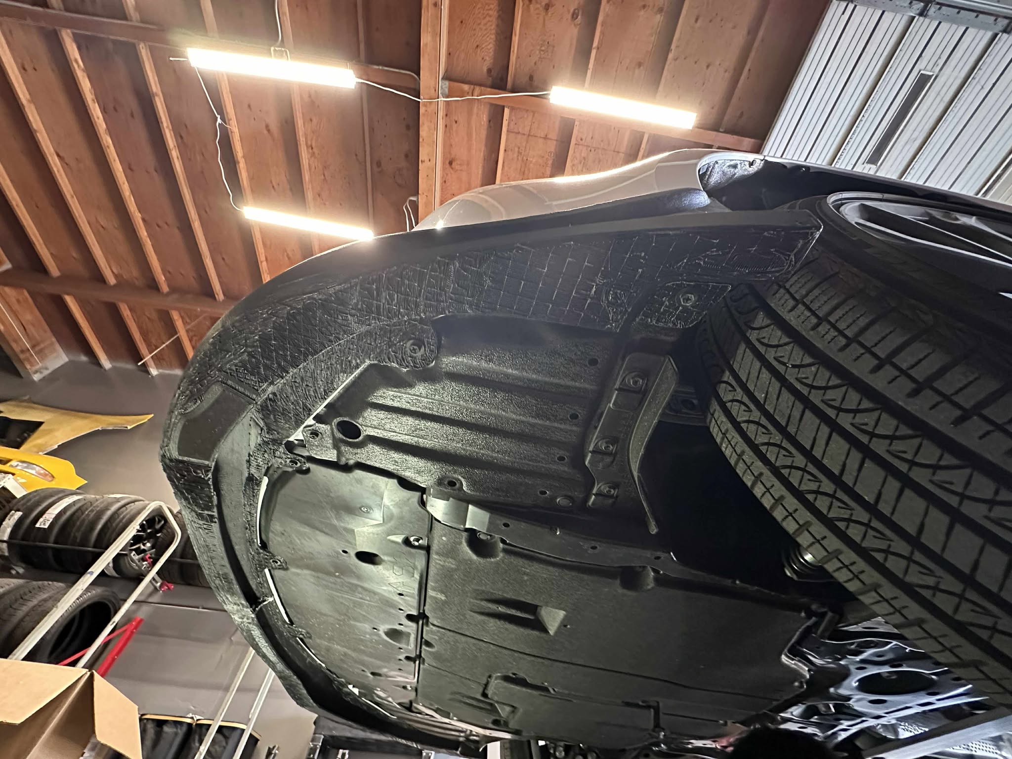 Underside view of the Epsilon+ front lip mounted to a Corolla Hatchback bumper