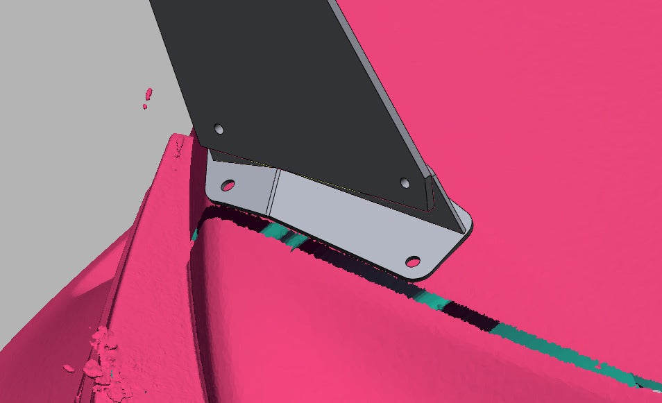 Close-up of the chassis-specific base plate against the ZN6 deck lid edge