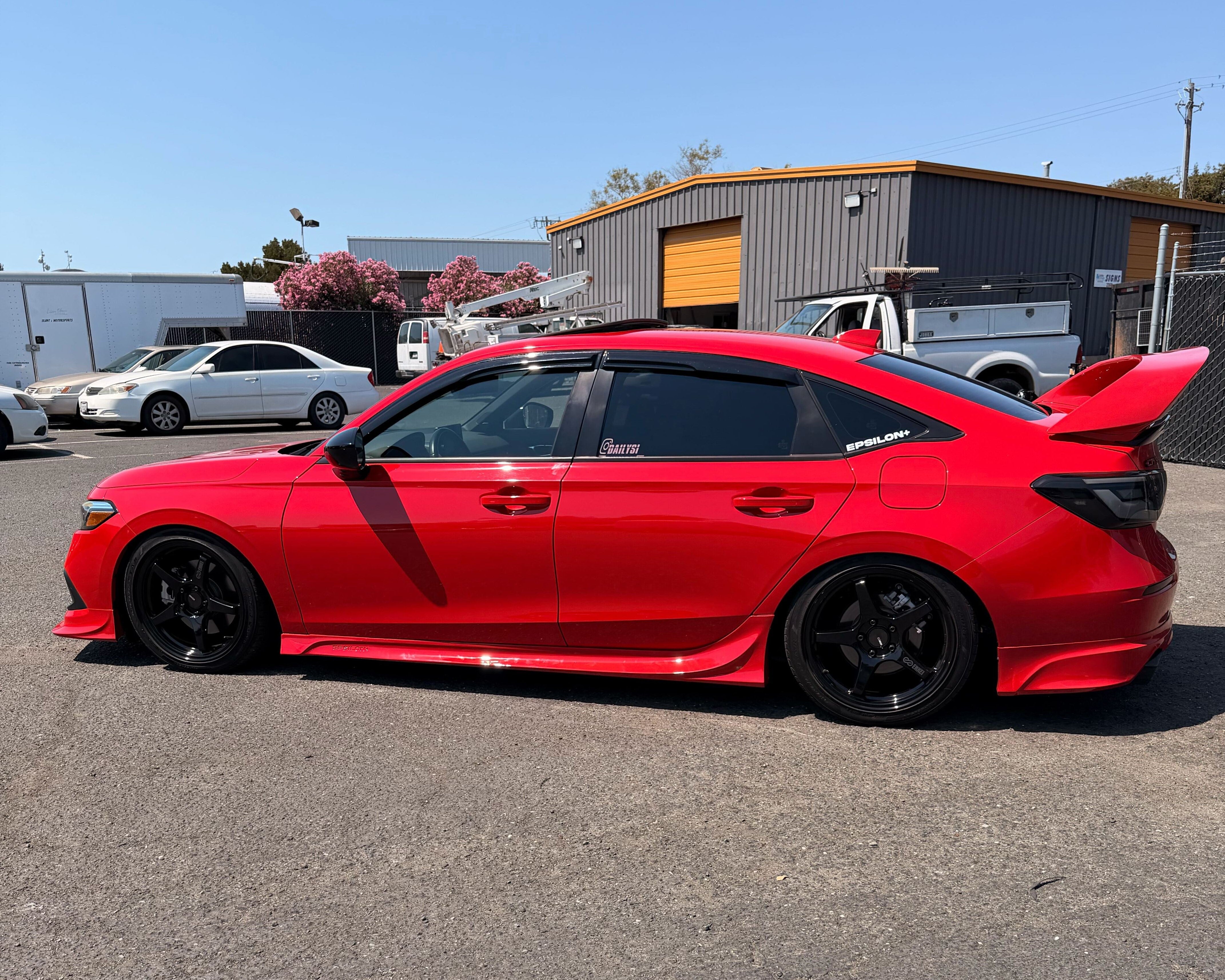 Red Honda Civic with the Epsilon+ side skirts, side profile view