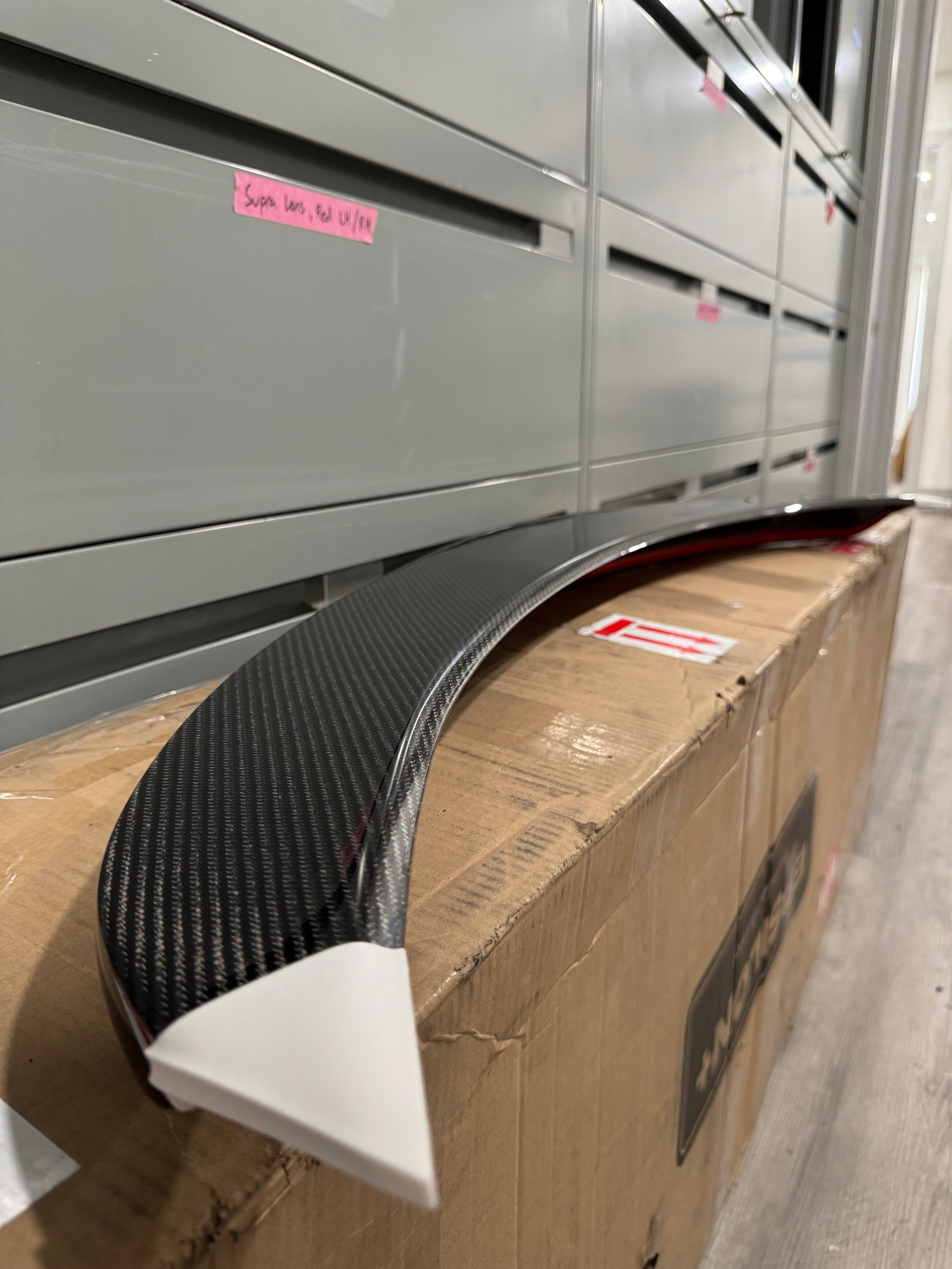 Carbon fiber and painted Epsilon+ Integra rear trunk lips ready for shipping