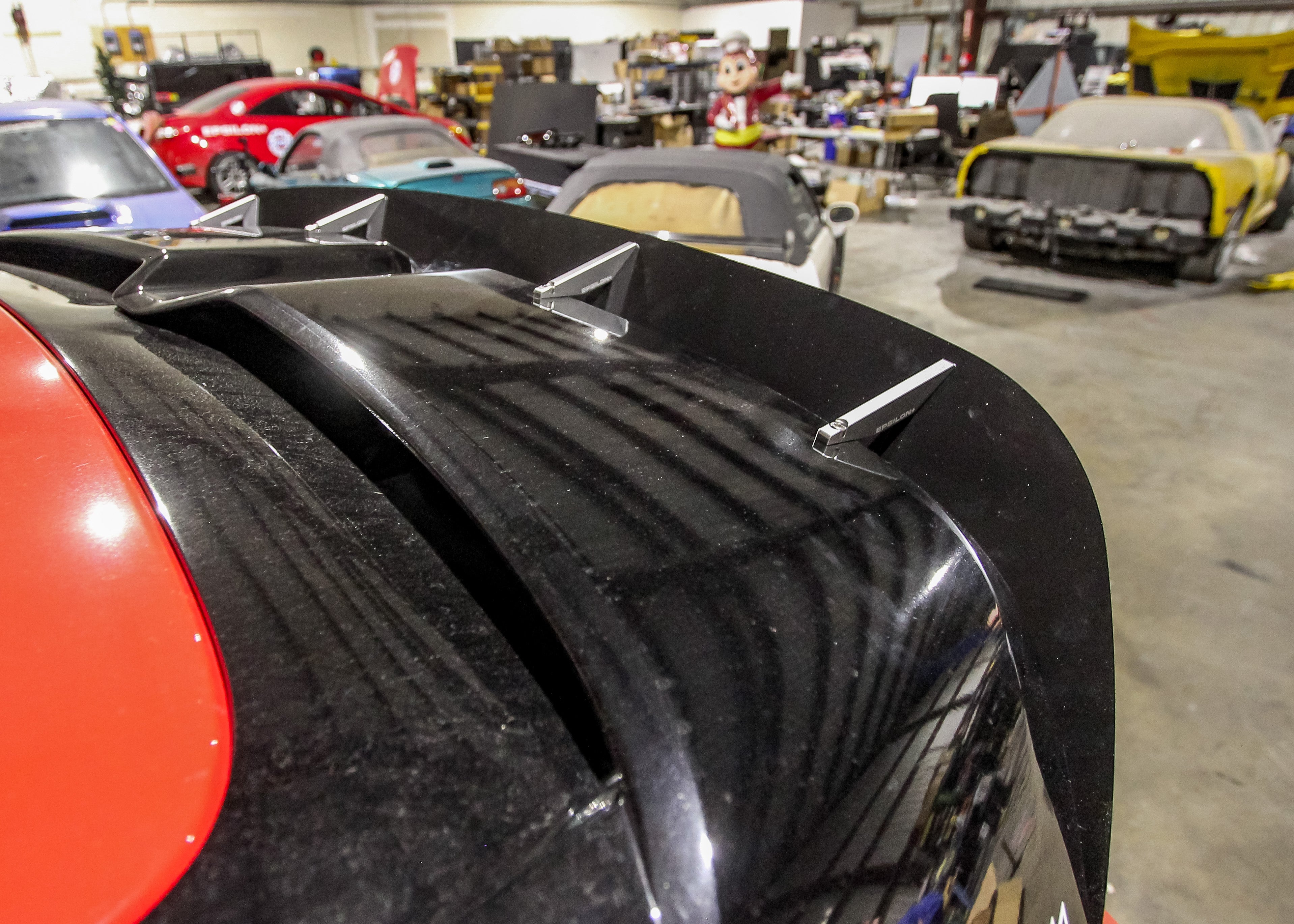 Close-up of the carbon fiber spoiler extension on a Kona N wing