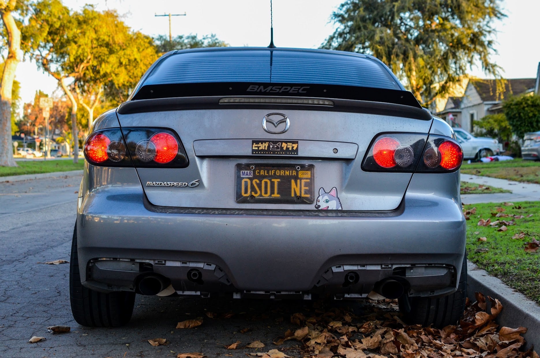 Rear view of a silver Mazdaspeed6 showing the spoiler extension and taillights