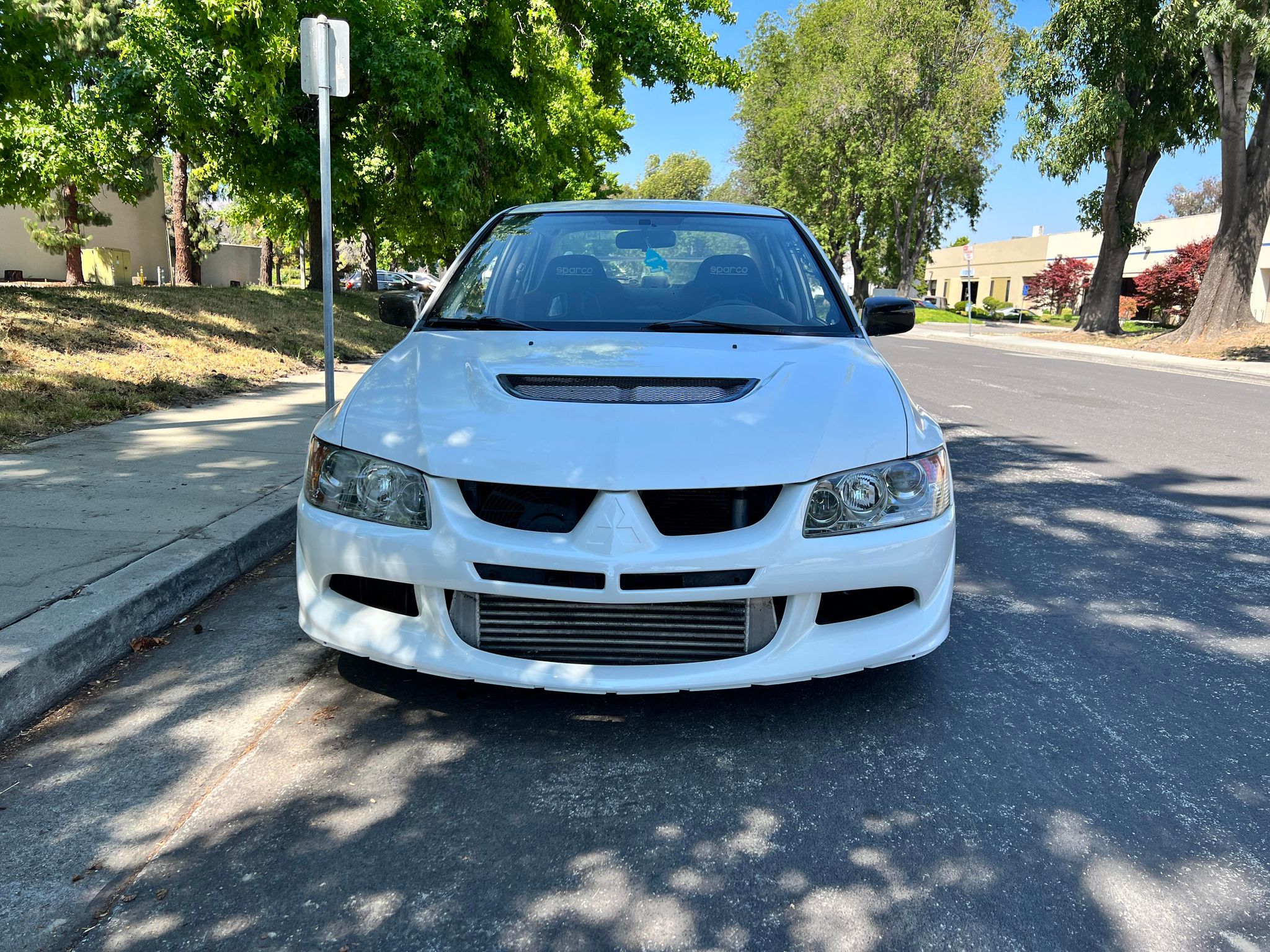 Front-on view of a white Mitsubishi Evo 8 fitted with the Epsilon+ front bumper