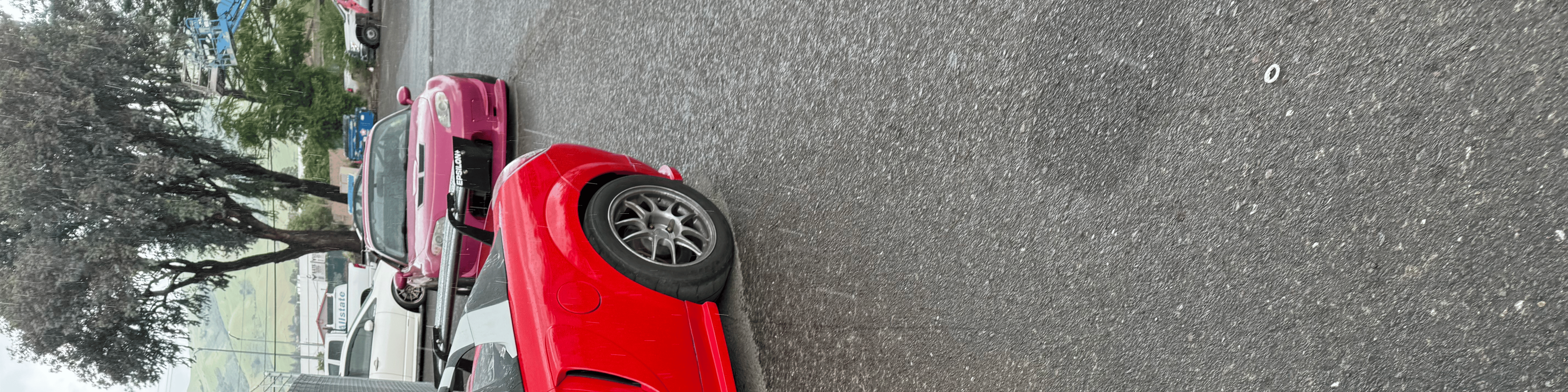 Overhead view of a red Toyota MR2 Spyder showing the open cockpit