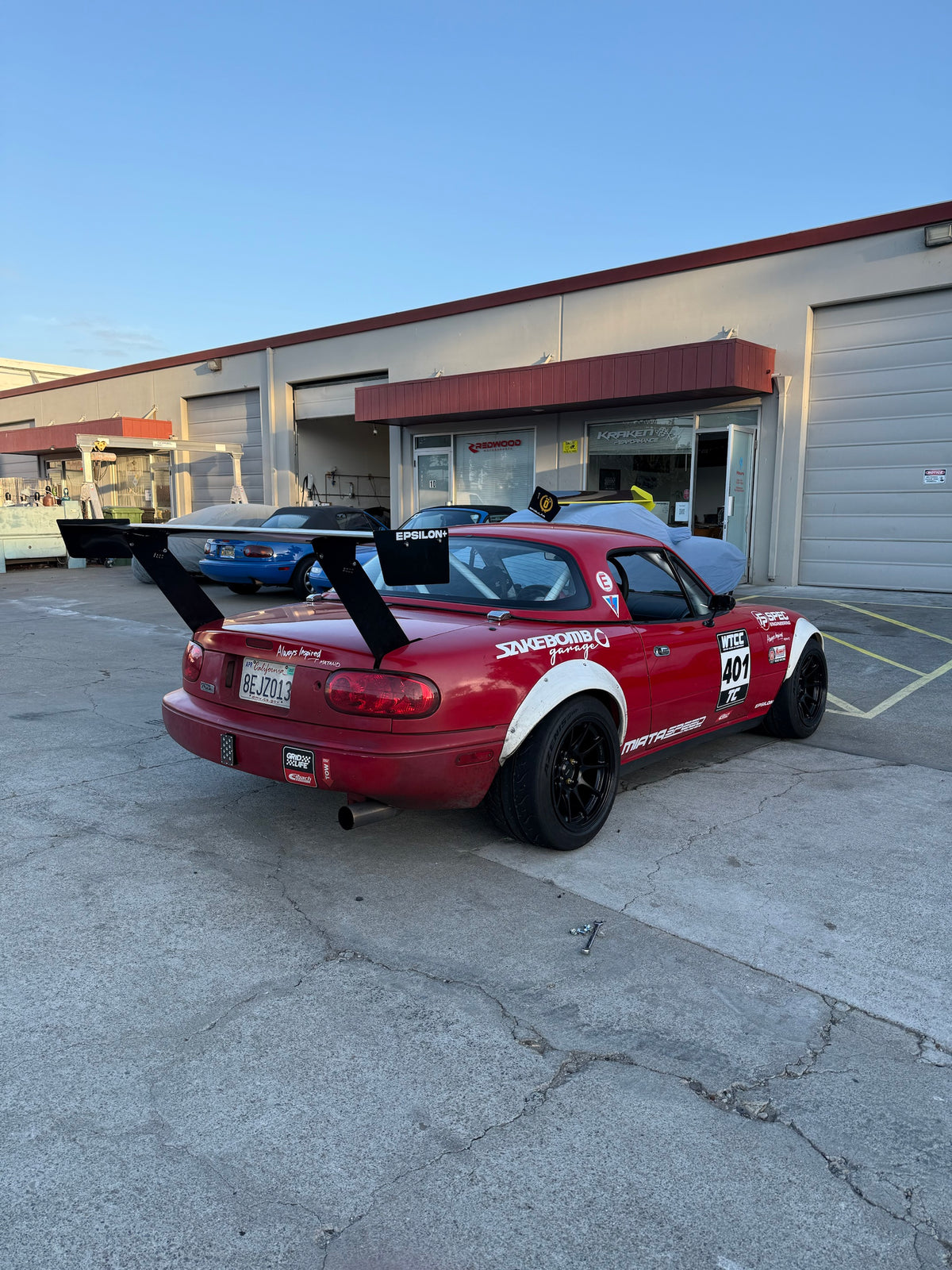 66.5" TC Wing on NA Miata, rear quarter view from the passenger side