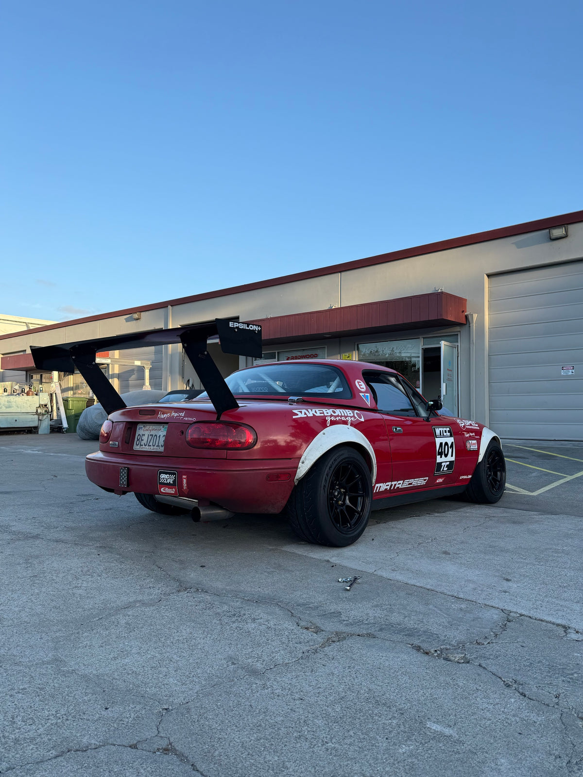 Epsilon+ 66.5" TC Wing installed on a Mazda Miata NA race car, rear three-quarter view