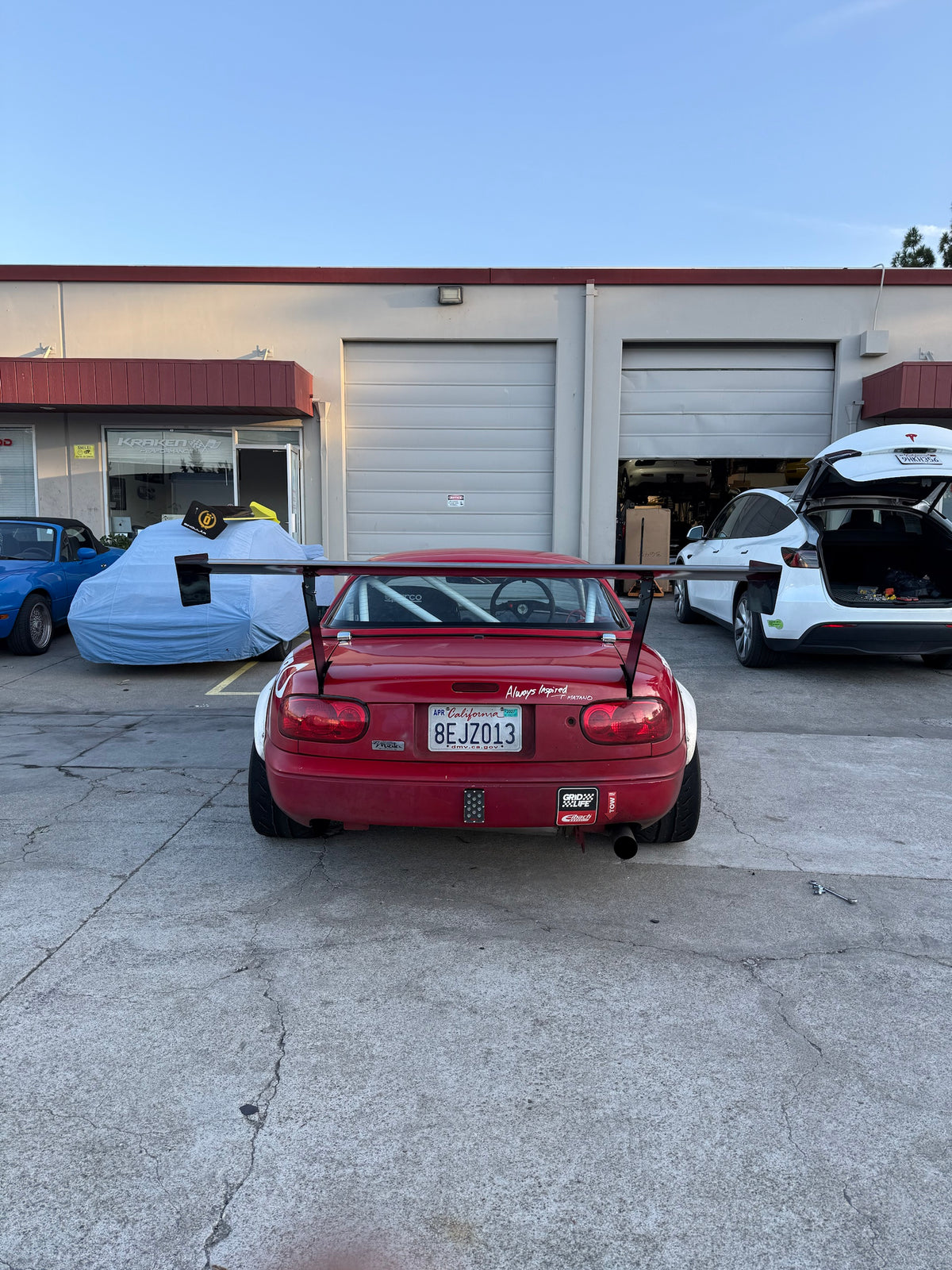 Mazda Miata NA with 66.5" TC Wing, centered rear view showing wing overhang