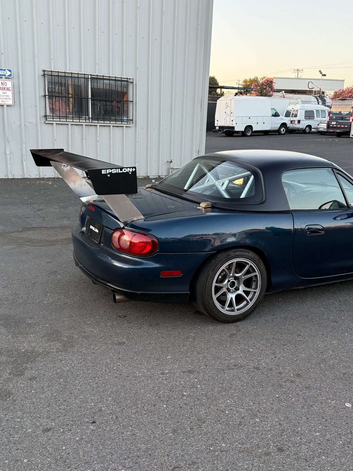 Mazda Miata NB with the Epsilon+ TC Wing fitted, rear three-quarter view showing endplate branding