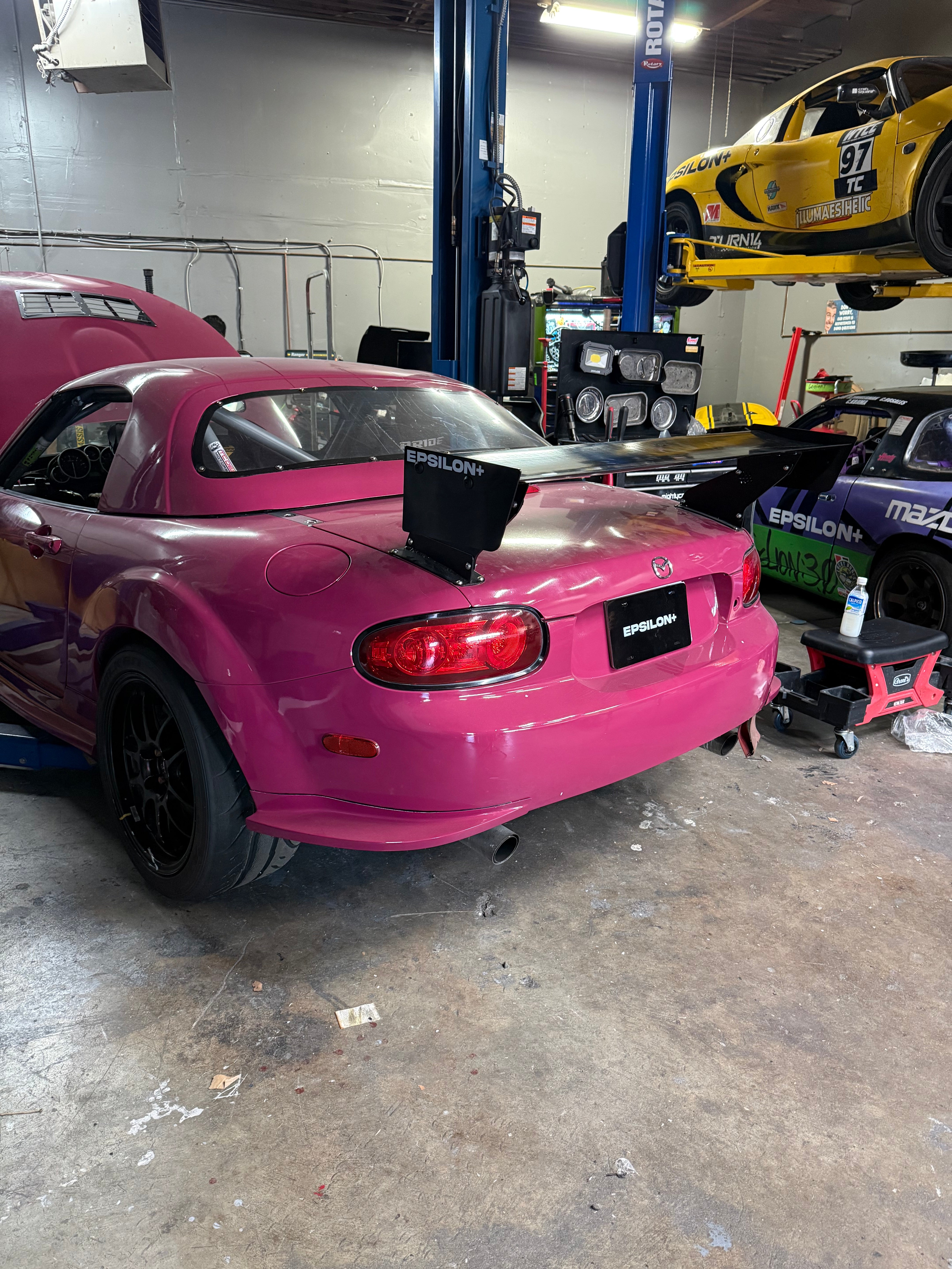 Epsilon+ TC Wing installed on Mazda Miata NC, in the shop with other Epsilon+ race cars