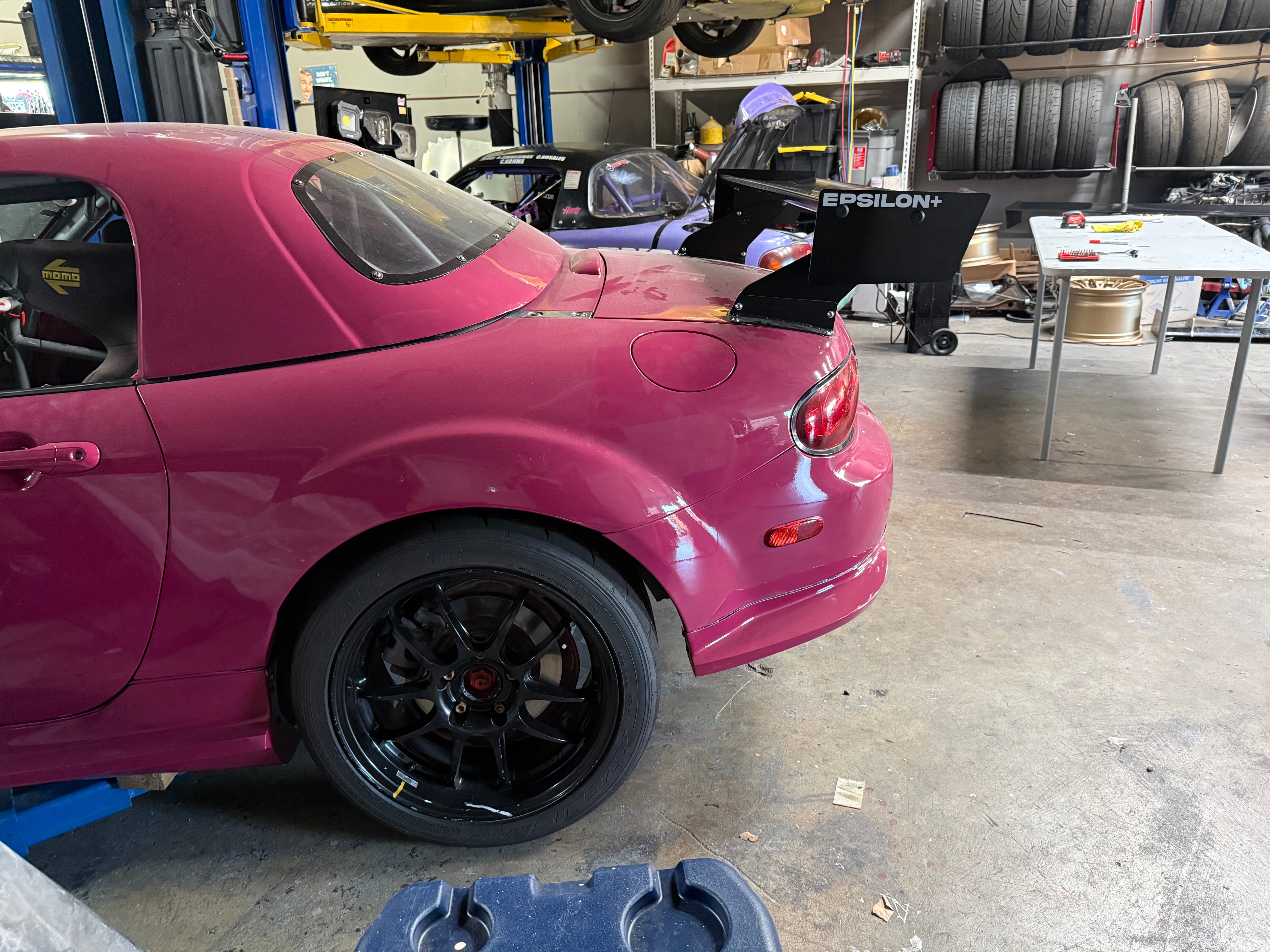 Epsilon+ TC Wing installed on Mazda Miata NC, side quarter view in shop