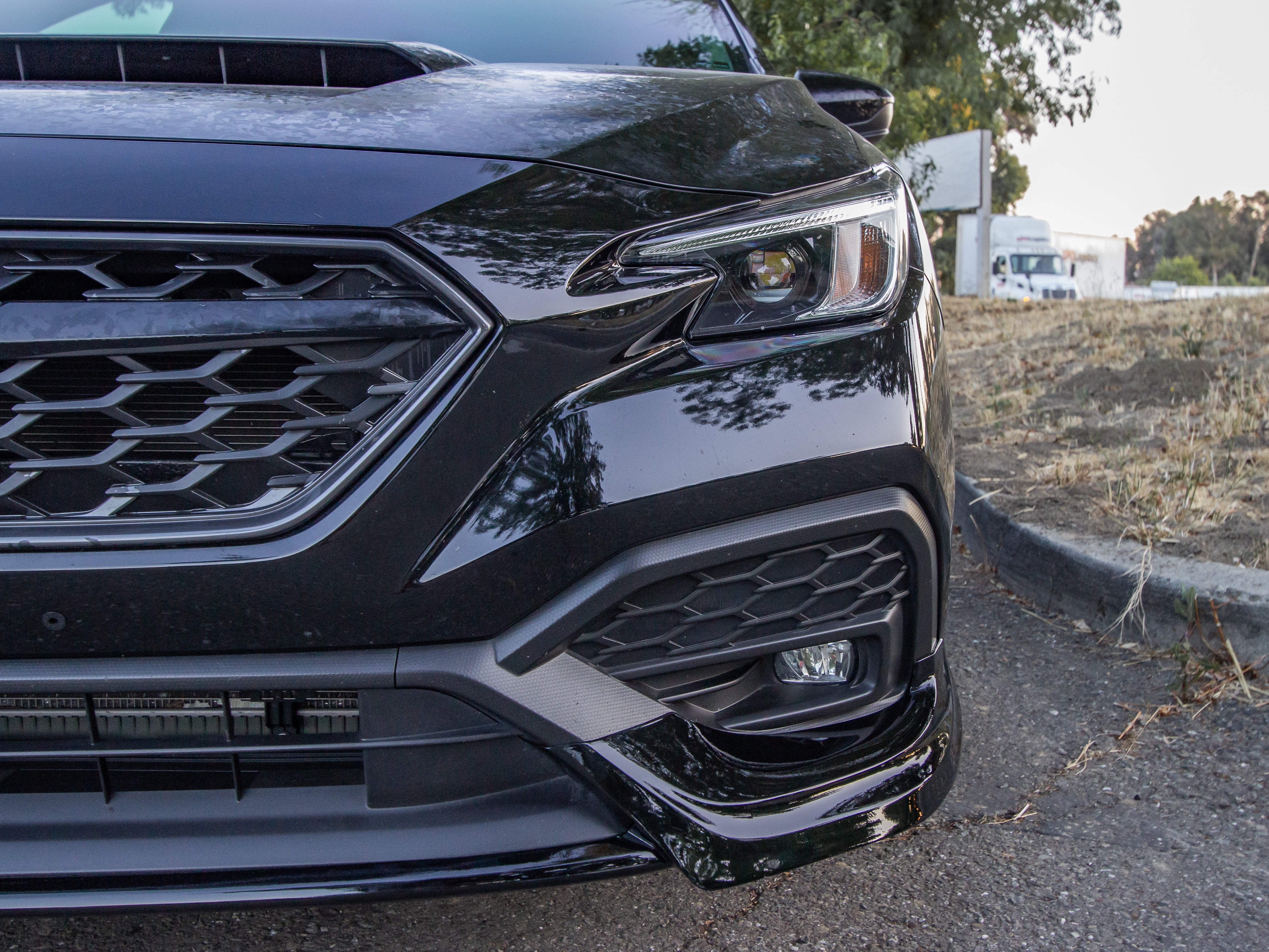 Front-on view of a black Subaru WRX VB with the Epsilon+ front lip installed