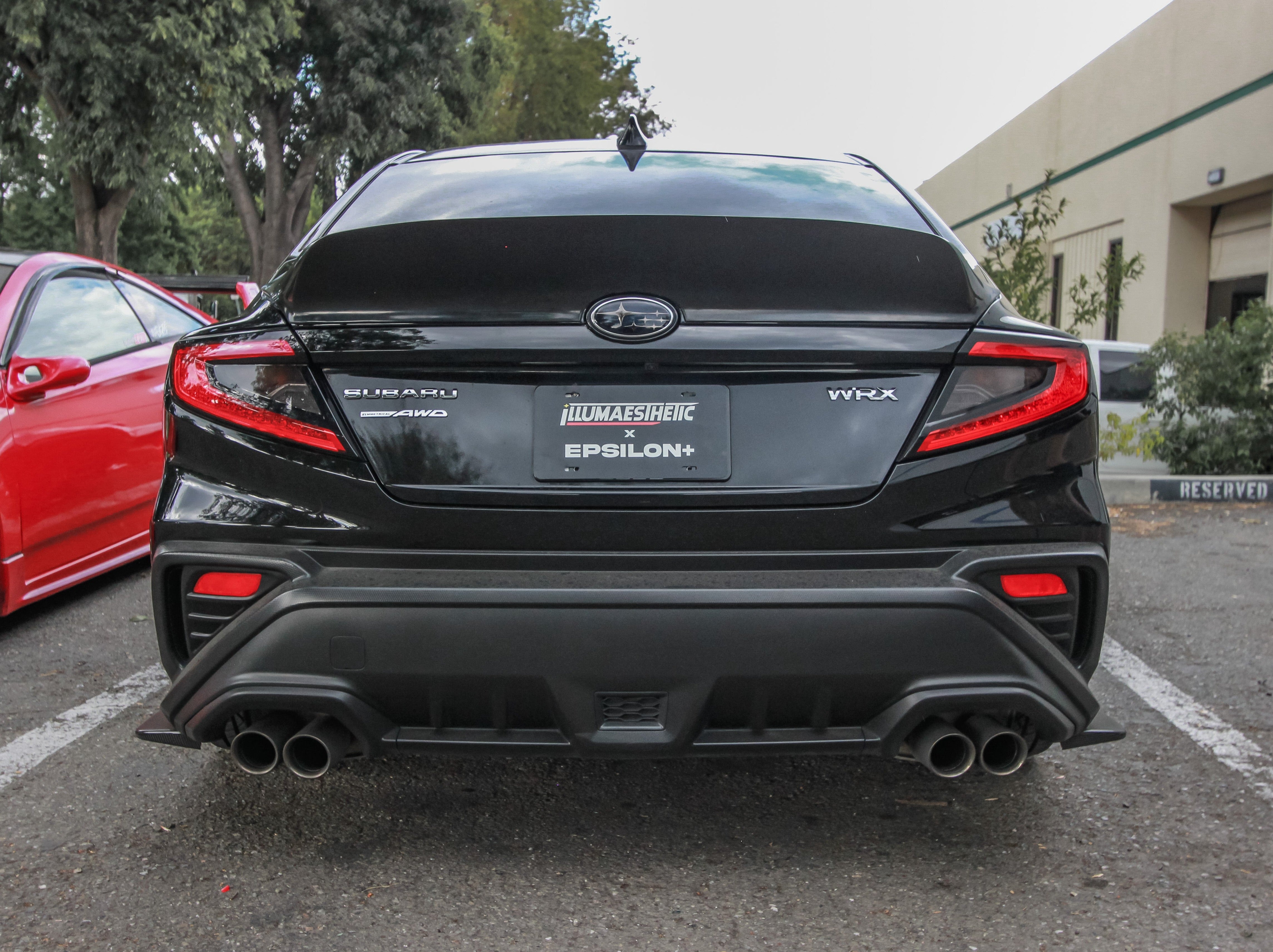 Rear-on view of a black Subaru WRX VB with rear duckbill and quad exhaust