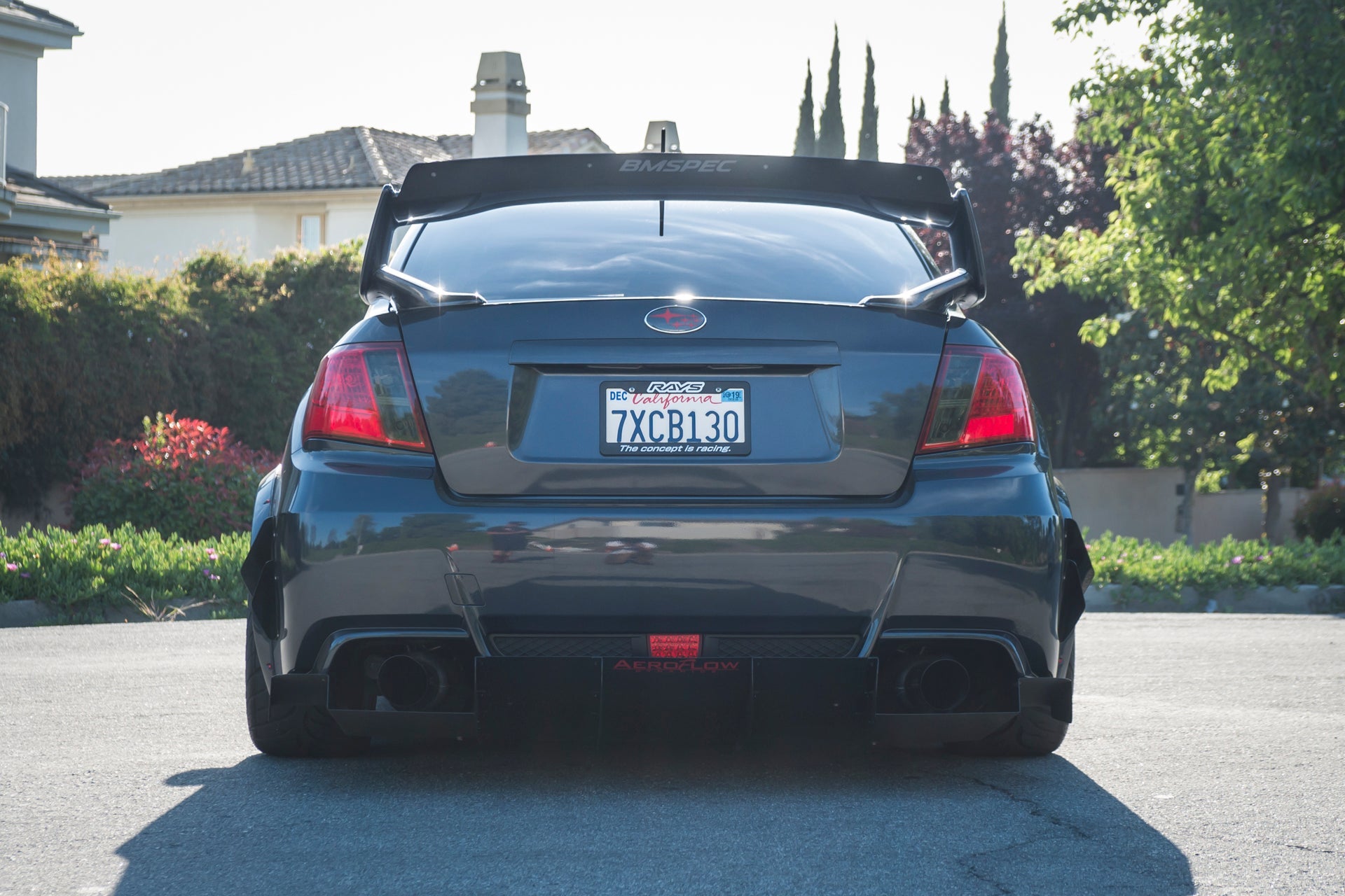 Rear view of a gray Subaru STI Sedan with Epsilon+ spoiler extension