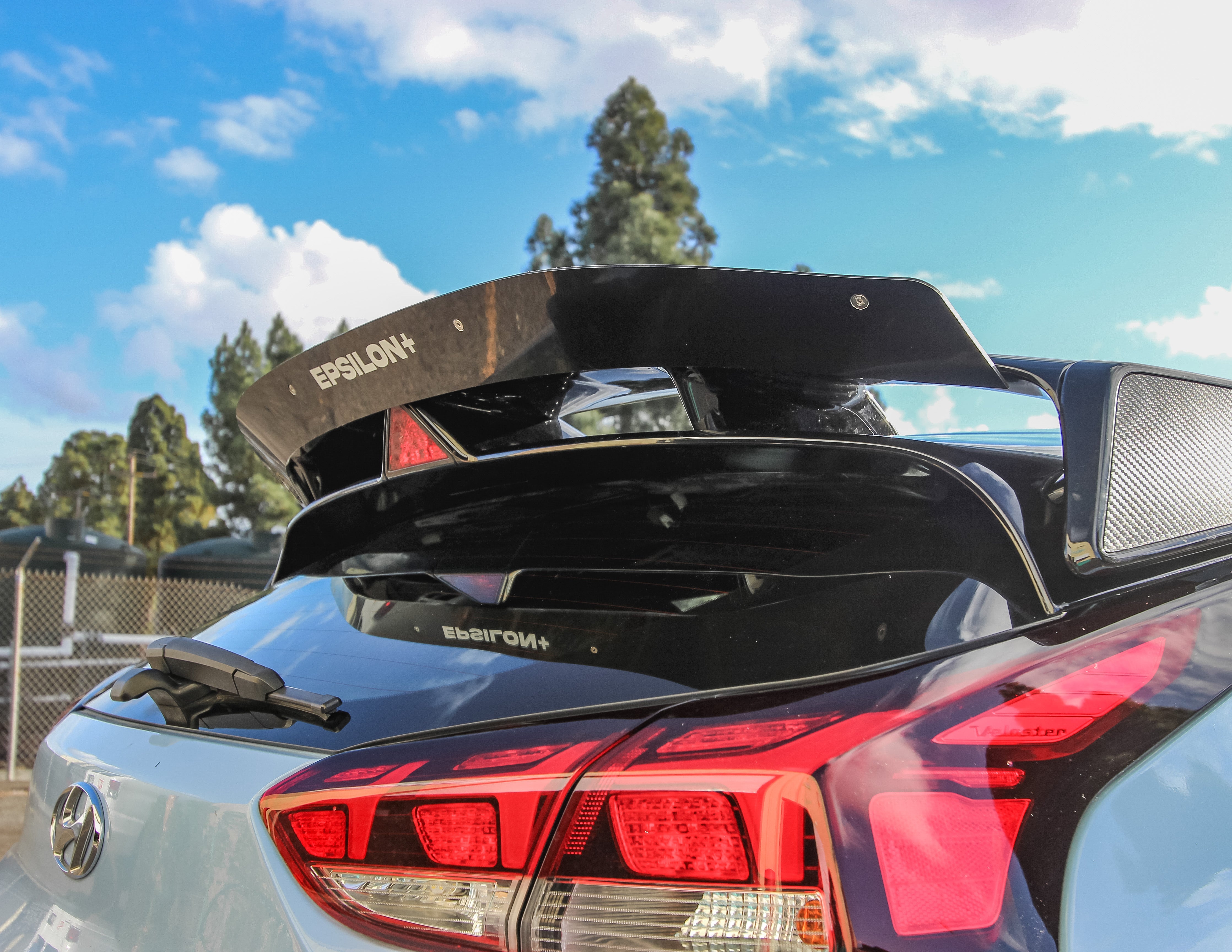 Close-up of the spoiler extension on a light blue Veloster N JS wing
