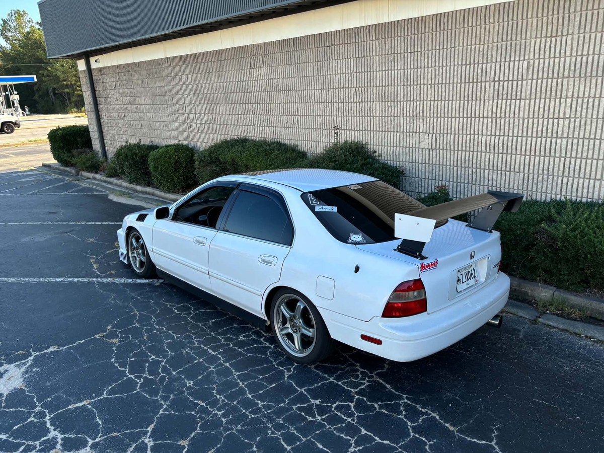 Honda Accord CD5 rear three-quarter view showing the TC Wing span, endplates and deck lid mounting