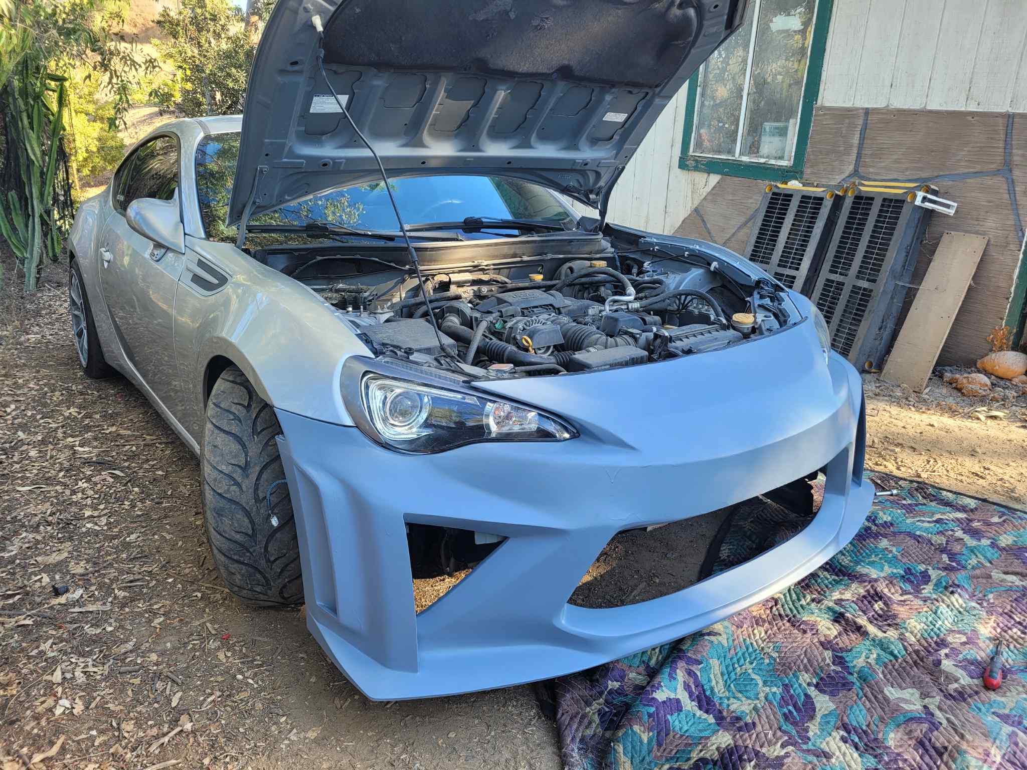 Front three-quarter view of a light blue Subaru BRZ with the Epsilon+ front bumper