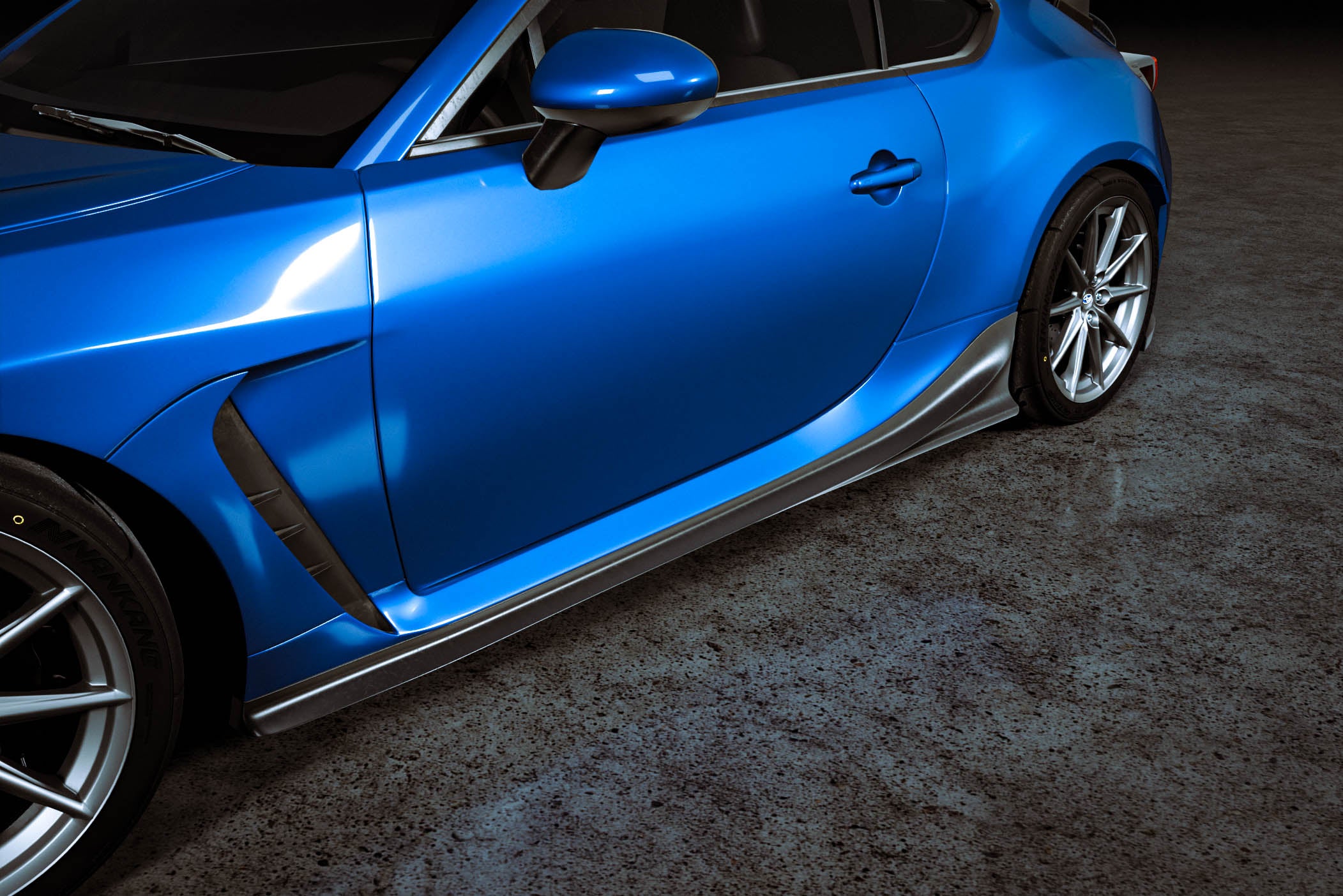 Close render of the side skirt along the rocker of a blue Subaru BRZ ZN8