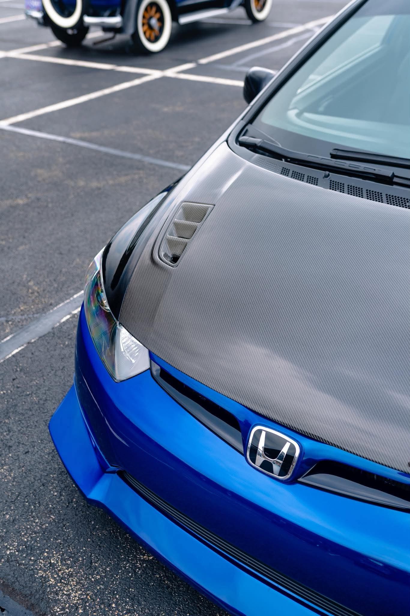 Close front view of the Epsilon+ front lip on a blue Honda Civic Coupe FG2