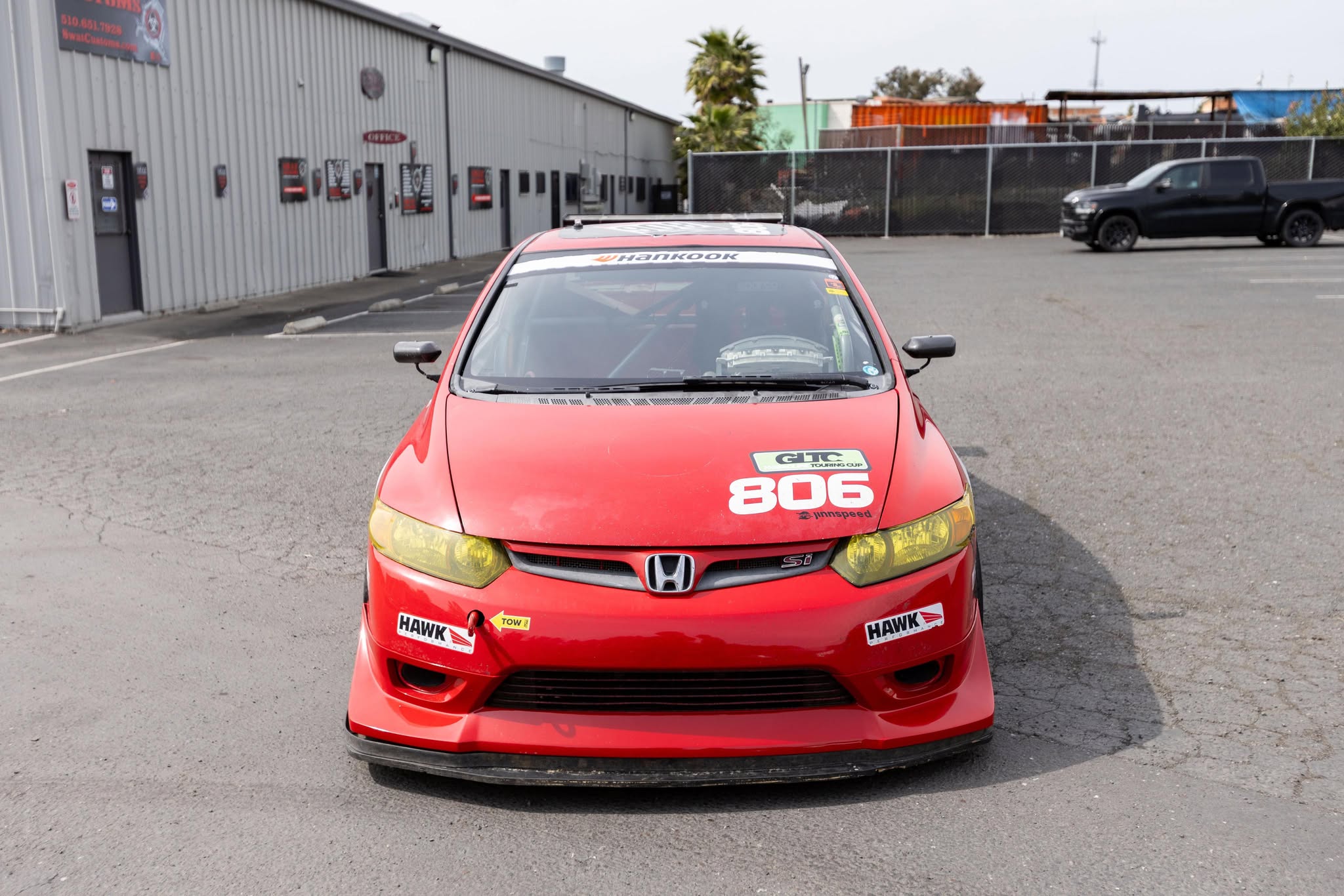 Front view of a red Honda Civic Coupe FG2 with the Epsilon+ front lip