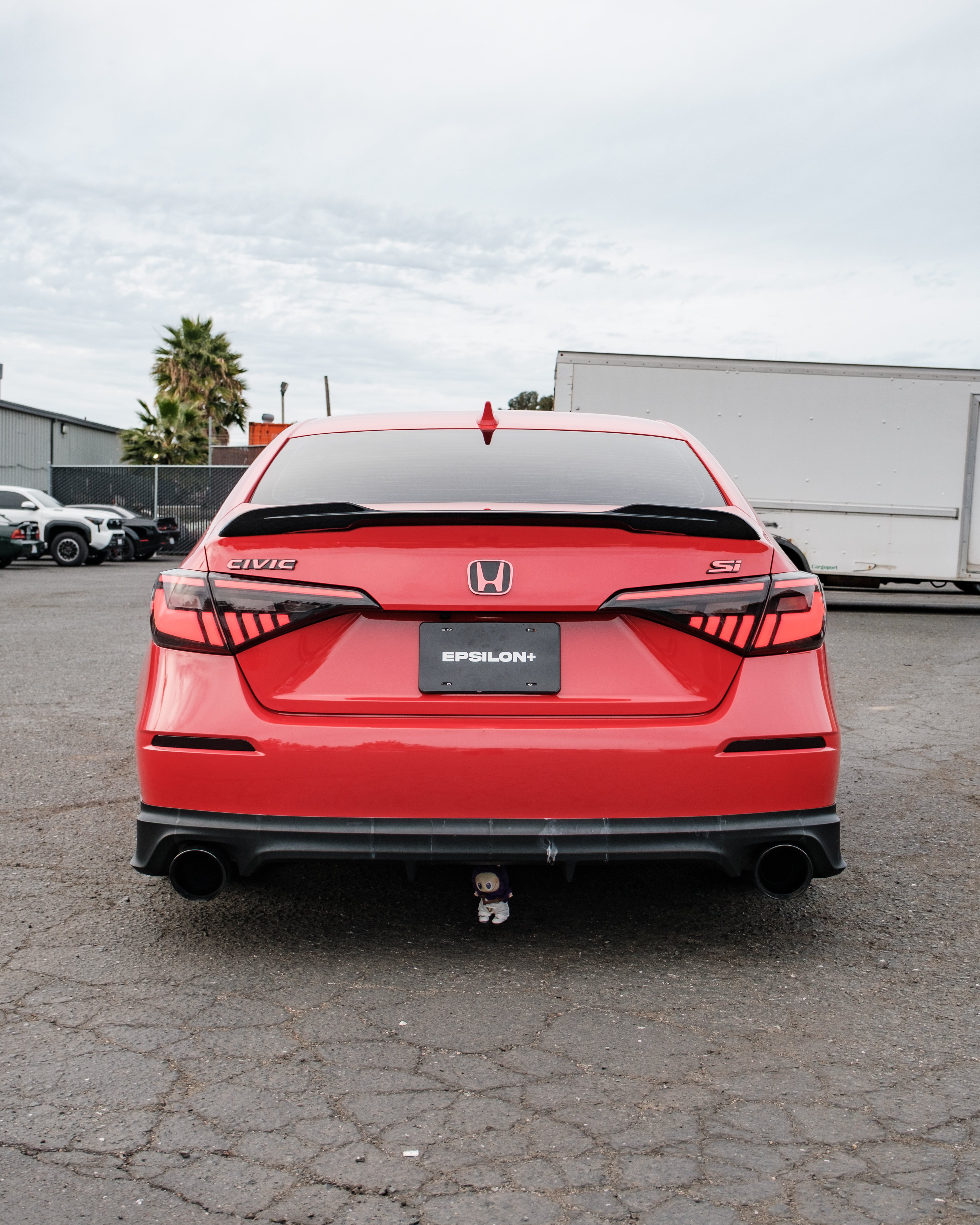 Rear view of a red Honda Civic Sedan with the Epsilon+ rear lip