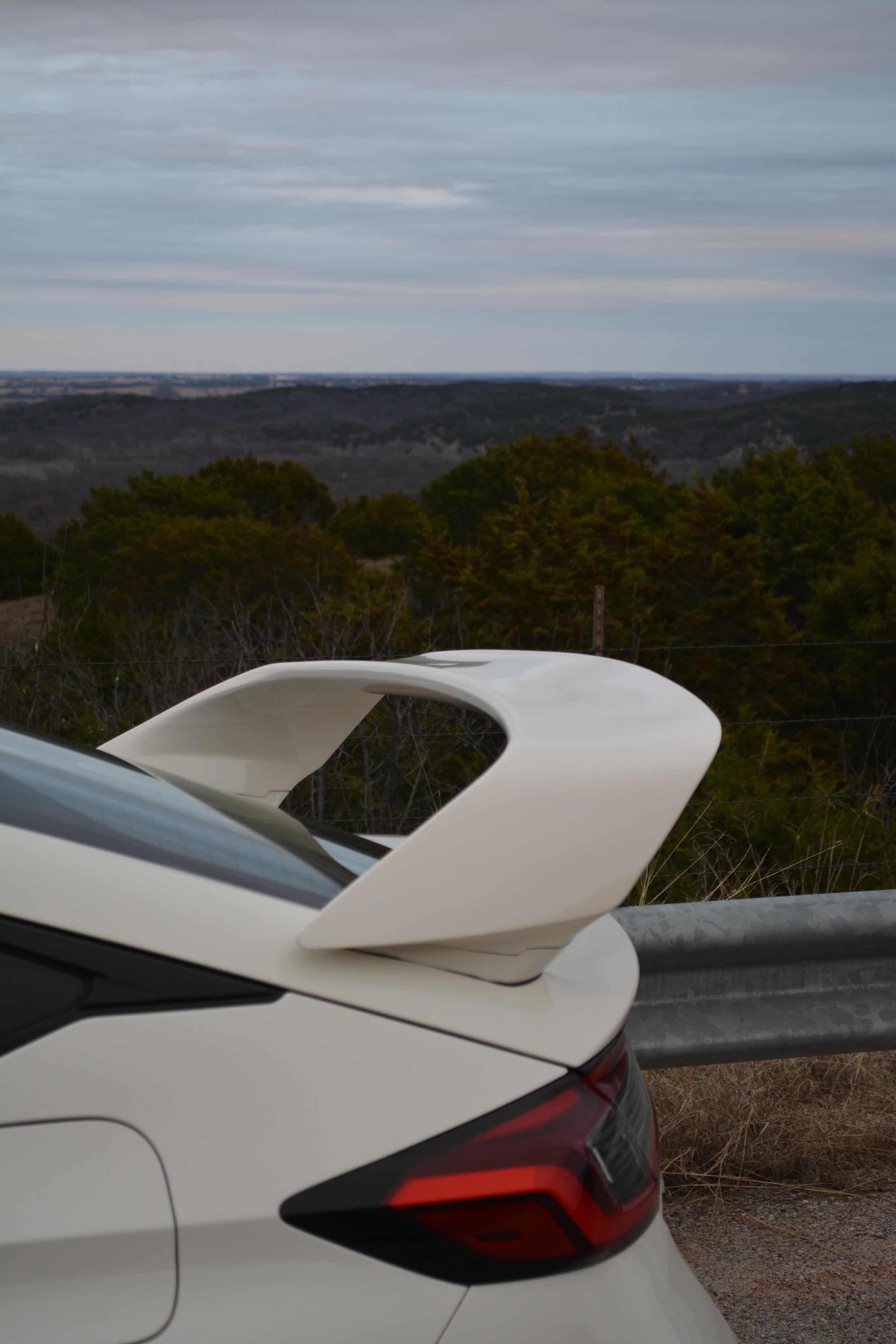 Close-up of the Sport Wing endplate beside the taillight on a white Civic FL5