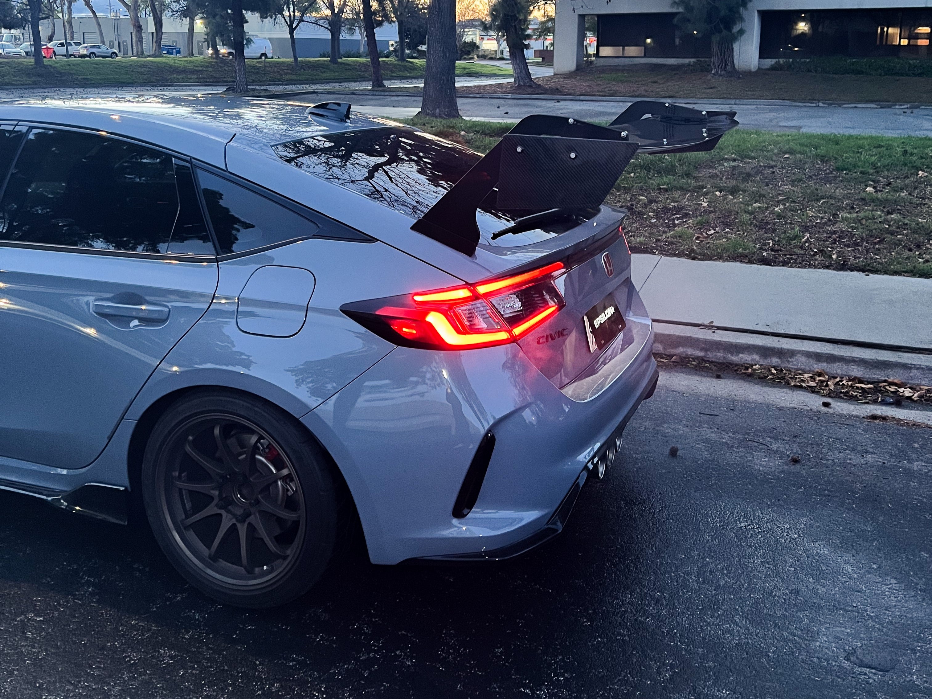 Rear three-quarter view of a gray Civic Type R FL5 with the Epsilon+ GT wing