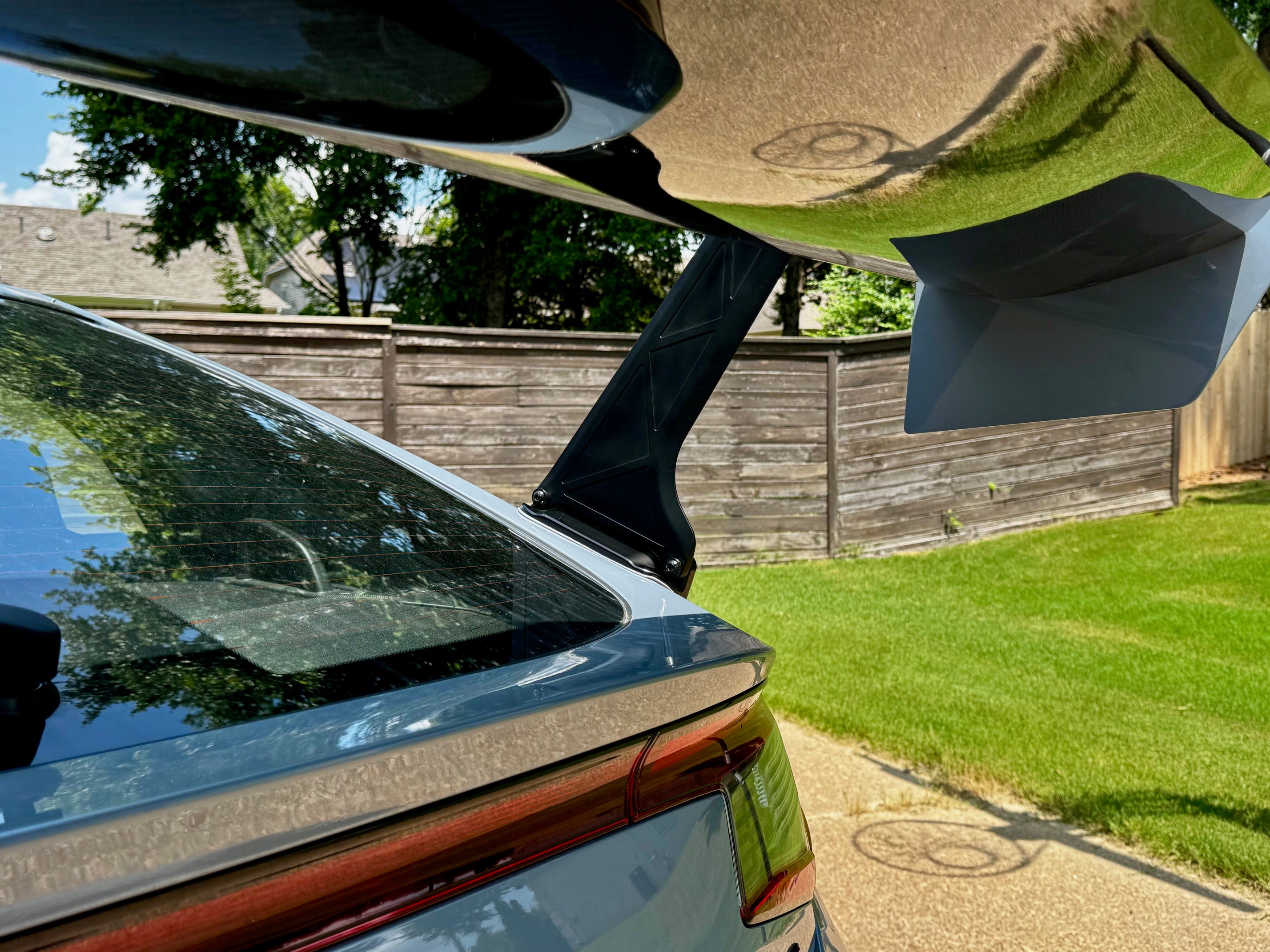 Underside view of the GT wing swan mount above the Civic Type R FL5 rear glass