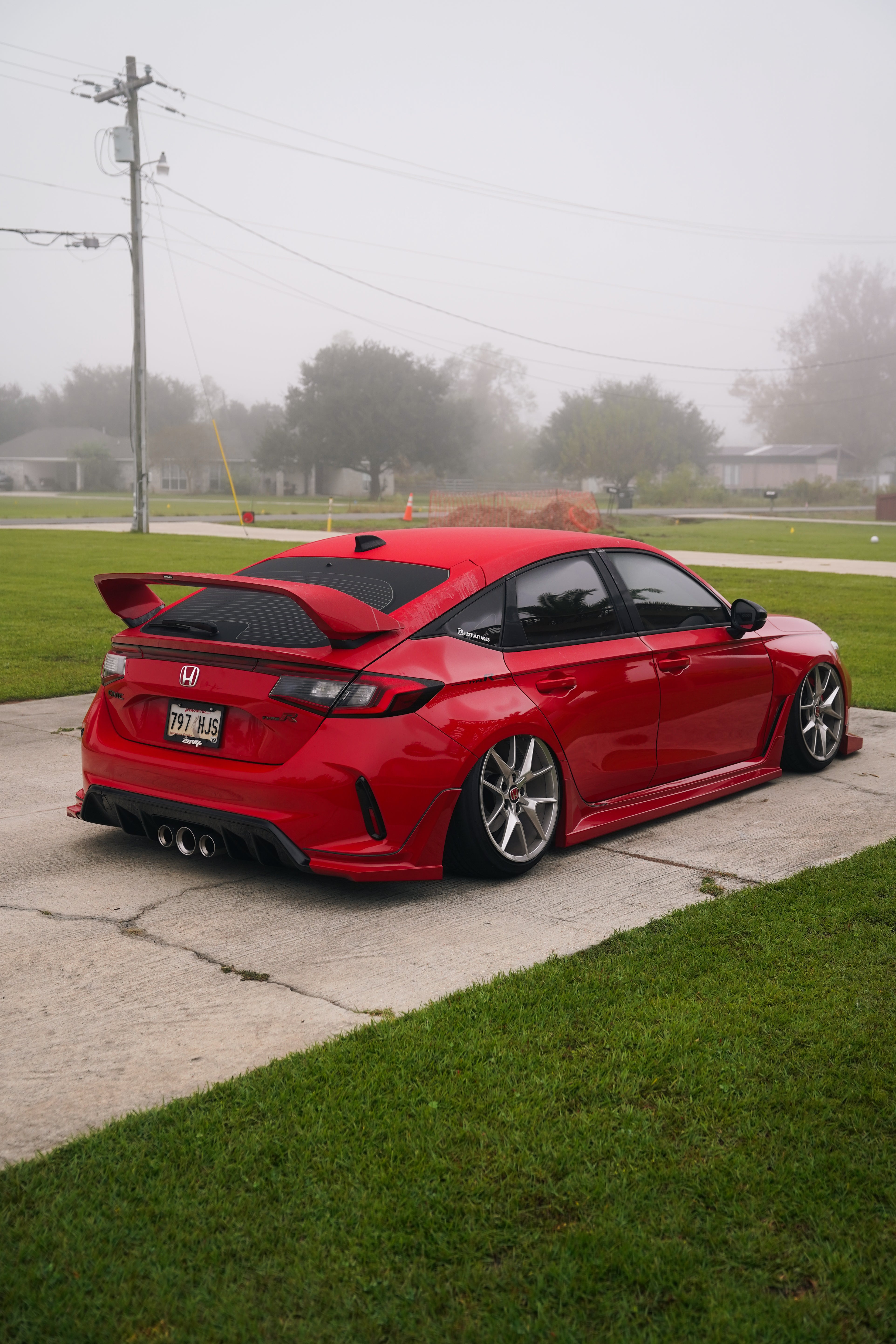 Red Honda Civic Type R FL5 with the Epsilon+ Sport Wing, rear three-quarter view