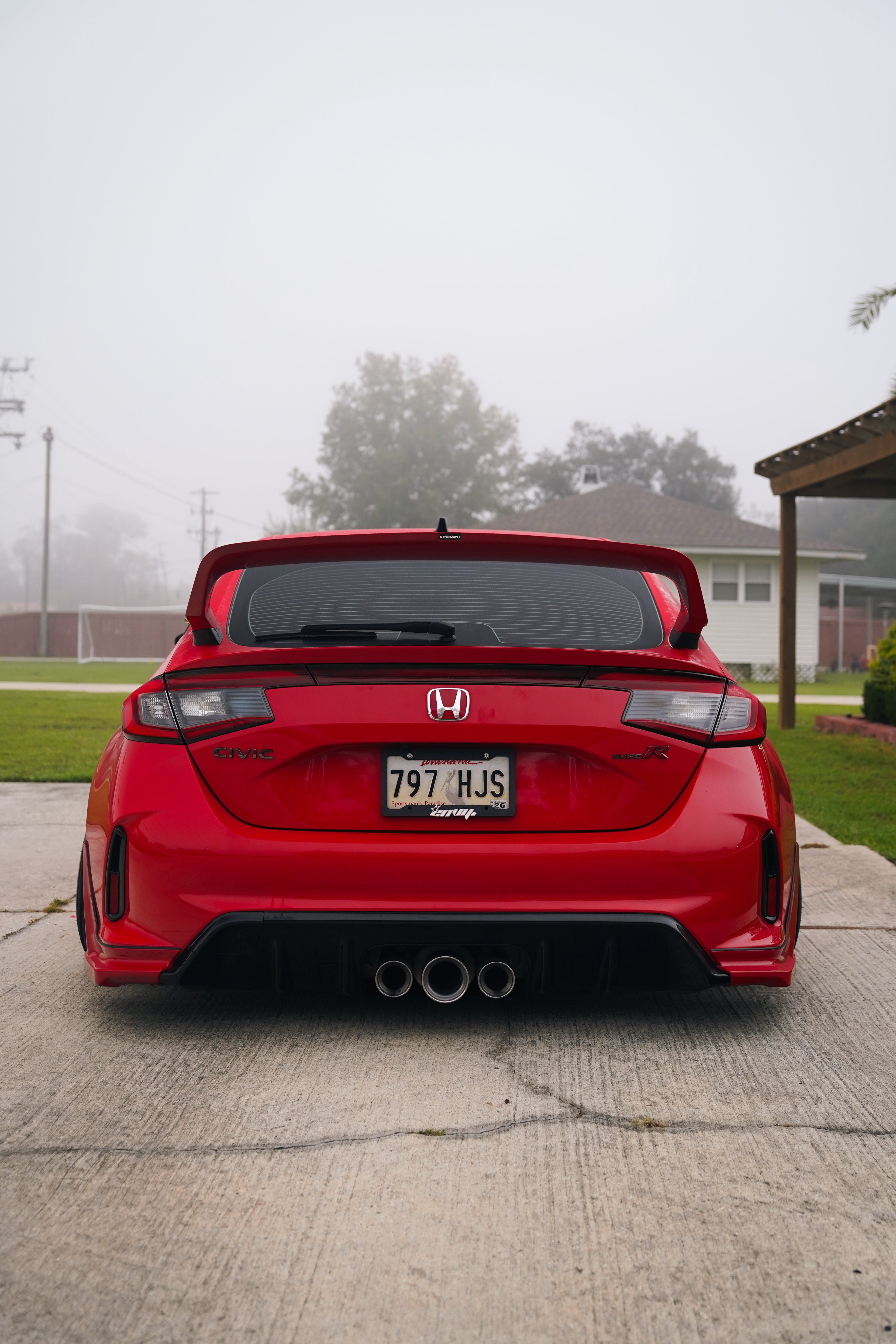 Rear view of a red Honda Civic Type R FL5 with the Epsilon+ Sport Wing