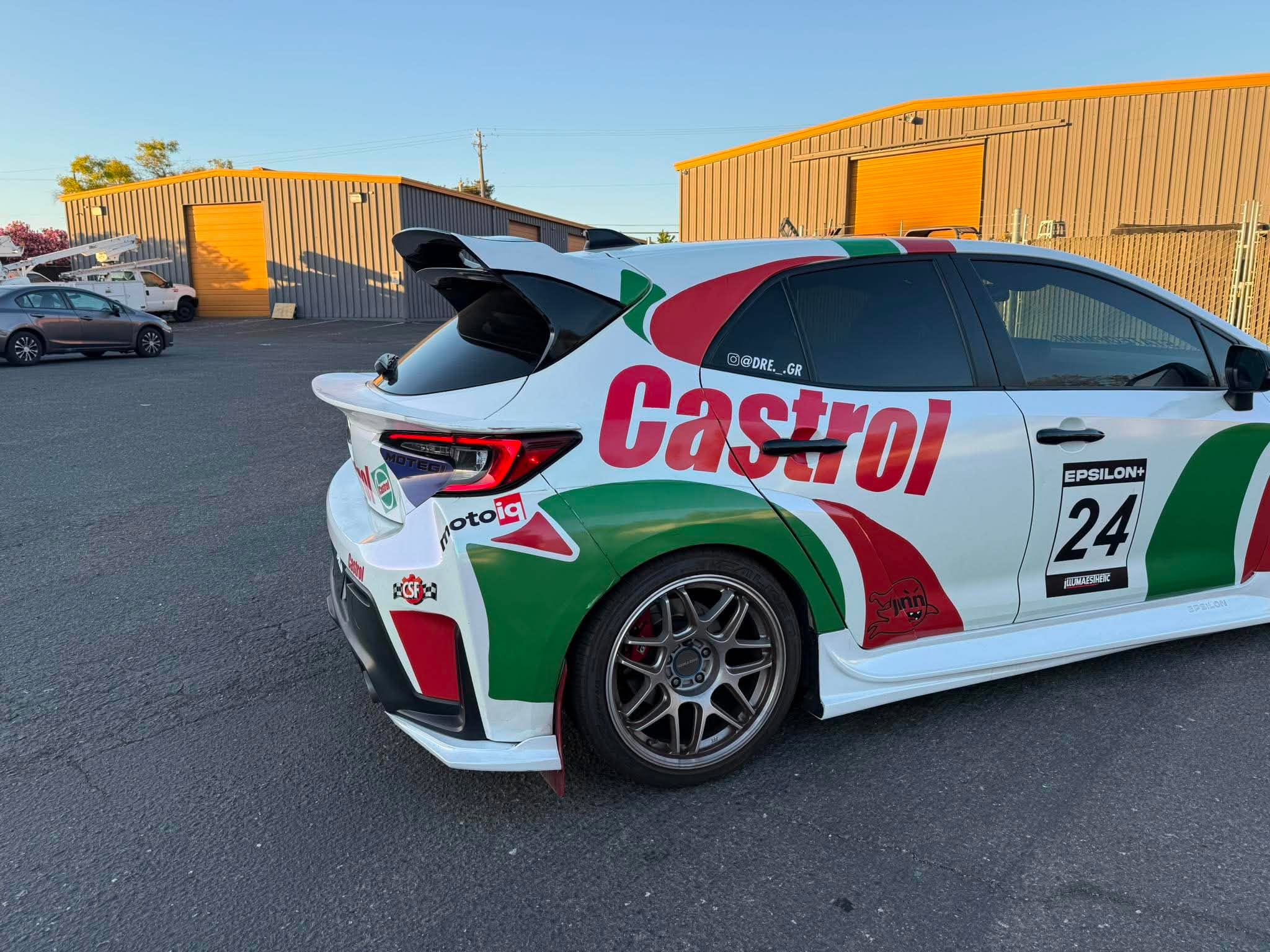 Side-rear view of a Castrol Corolla Hatchback race car with the Epsilon+ mid wing