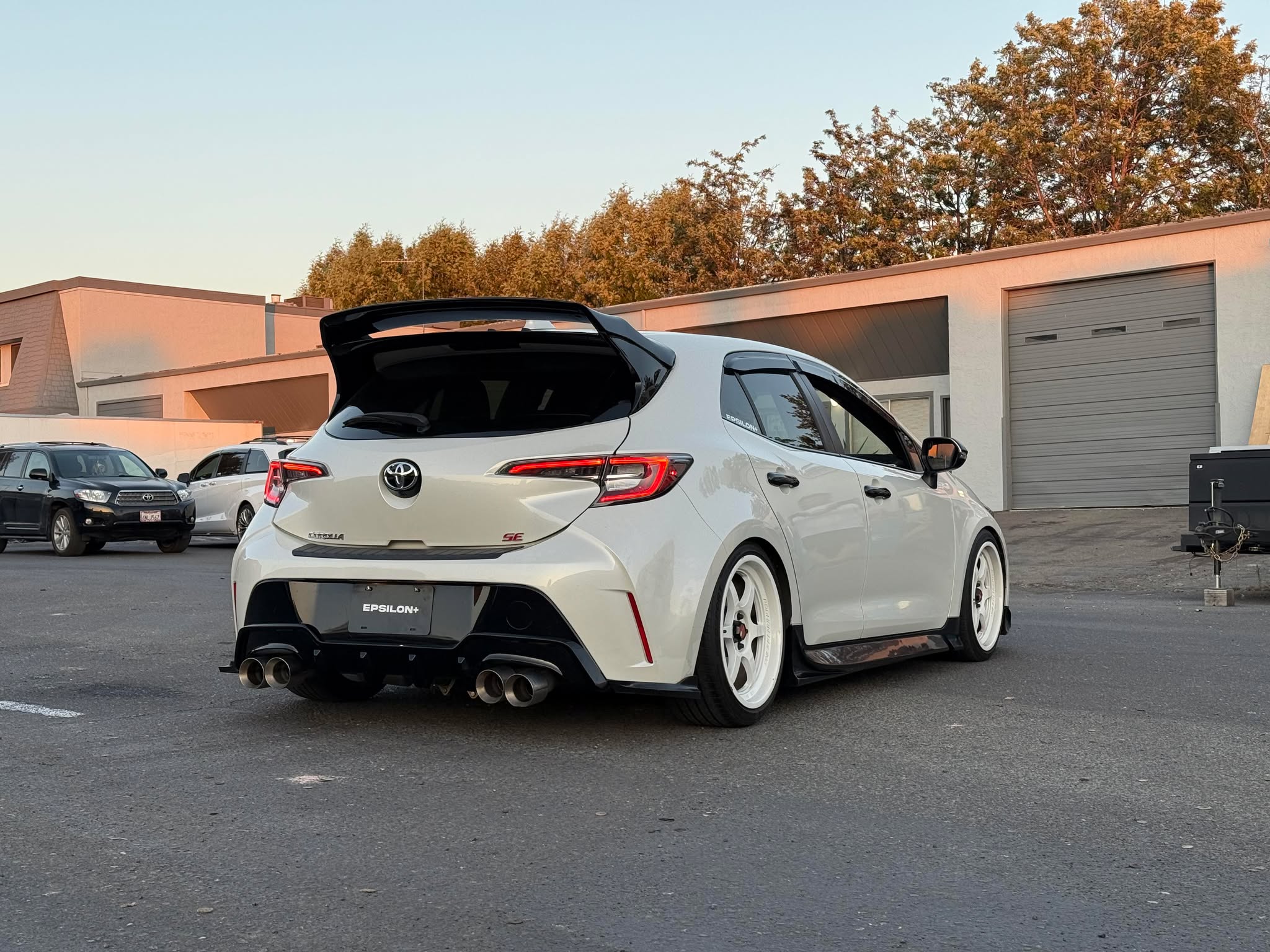 White Toyota Corolla Hatchback with Epsilon+ rear spats at sunset