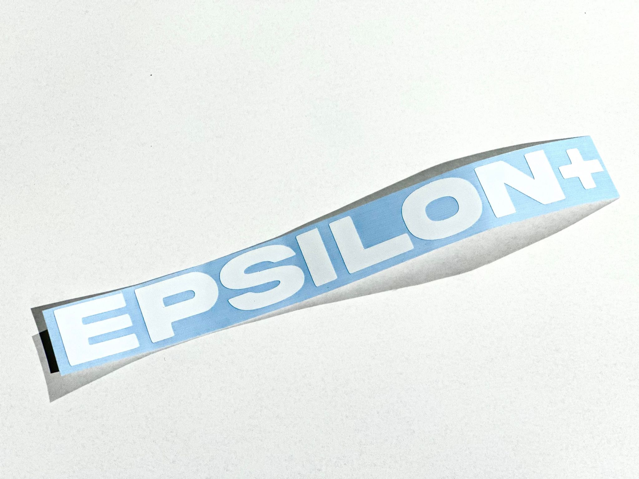 White Epsilon+ die-cut logo sticker, 7 by 1 inch