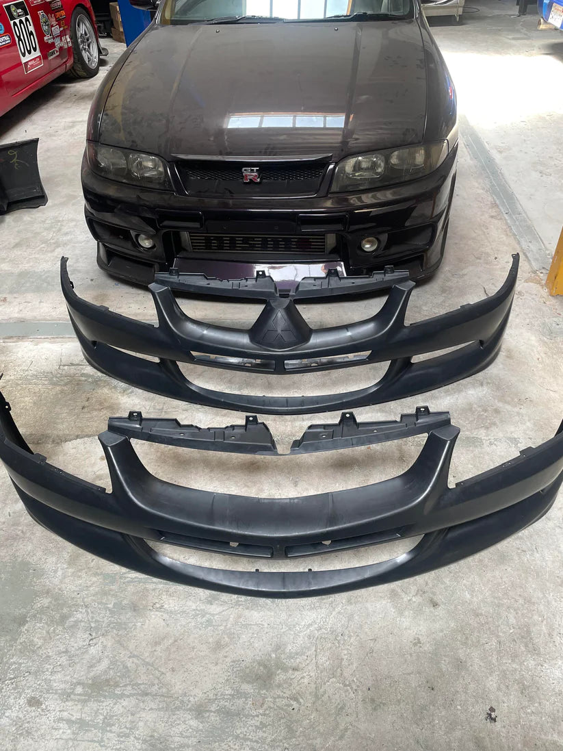 Mitsubishi Evo with the factory bumper removed beside the Epsilon+ replacement bumper